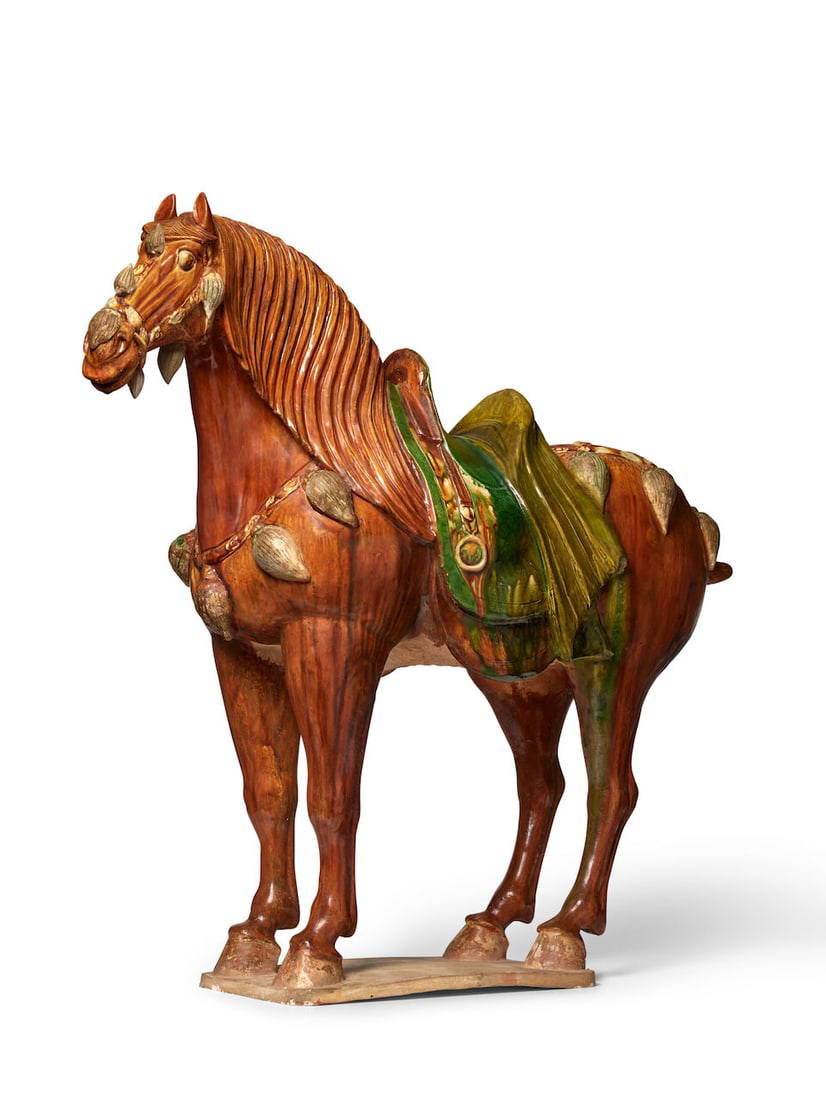 A LARGE SANCAI-GLAZED CAPARISONED FERGHANA HORSE Tang-style