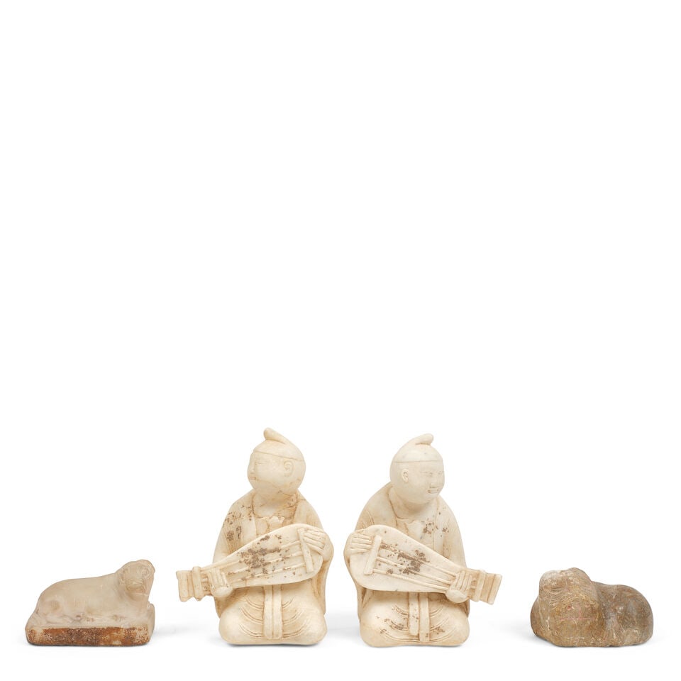 A GROUP OF FOUR MARBLE AND PUDDINGSTONE CARVINGS Figures and ox: Tang-style;Tiger: Han-style (4): A GROUP OF FOUR MARBLE AND PUDDINGSTONE CARVINGS Figures and ox: Tang-style; Tiger: Han-style Including a pair of seated musicians; a recumbent ox weight; and a recumbent tiger mat weight. Figures: 5