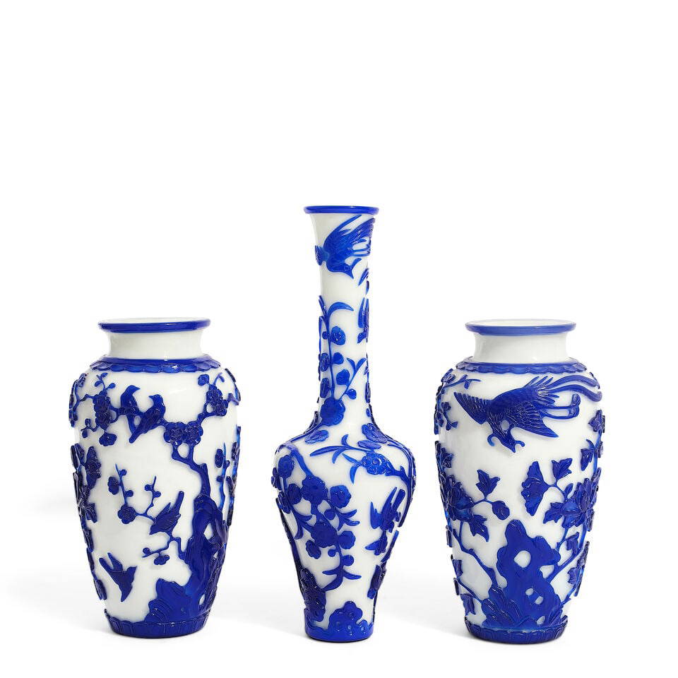 THREE LARGE BLUE OVERLAY 'BIRD AND FLOWER' PEKING GLASS VASES 20th century, the long-neck vase ...