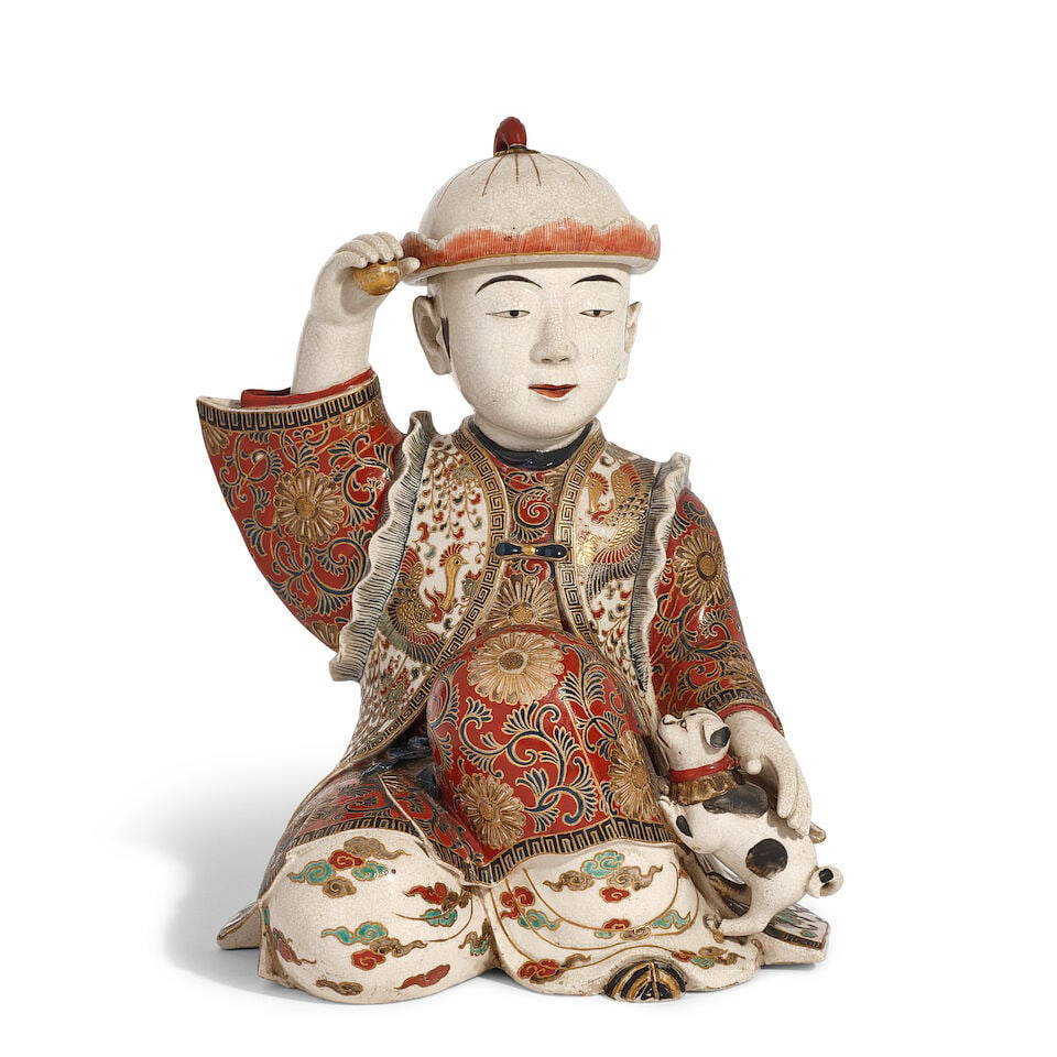 A JAPANESE GILT POLYCHROME SATSUMA FIGURE OF A BOY AND A PUPPY Meiji era (1868-1912), circa 1900