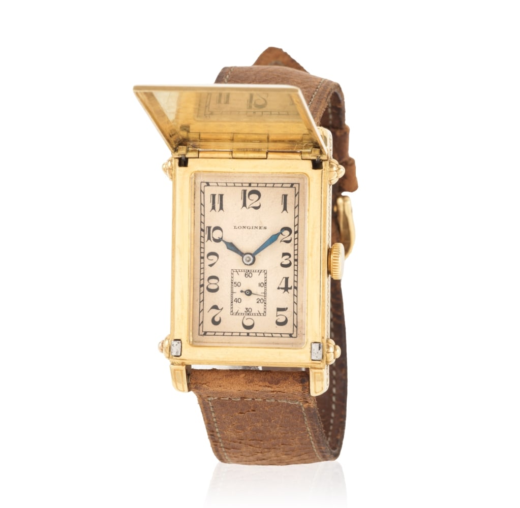 Longines. A unique and very fine large 18K gold manual wind bracelet watch with concealed dial a...: Longines. A unique and very fine large 18K gold manual wind bracelet watch with concealed dial and crest of H.M. King Alexander I of Yugoslavia Longines. Très belle montre bracelet unique dite '&