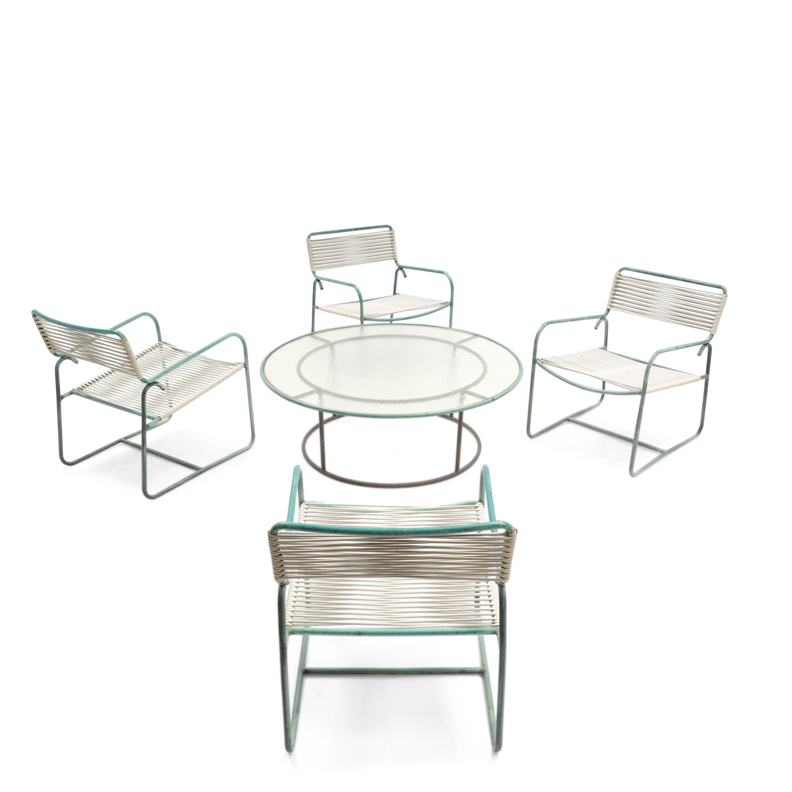 WALTER LAMB (ACTIVE 1950S) Four Lounge Chairs and Round Coffee Tablecirca 1955for Brown Jordan, ...: WALTER LAMB (ACTIVE 1950S) Four Lounge Chairs and Round Coffee Table circa 1955 for Brown Jordan, bronze tubing, rubber cord, glass height of table 17in (43.2cm); diameter of table 48 1/2in (123.2cm);
