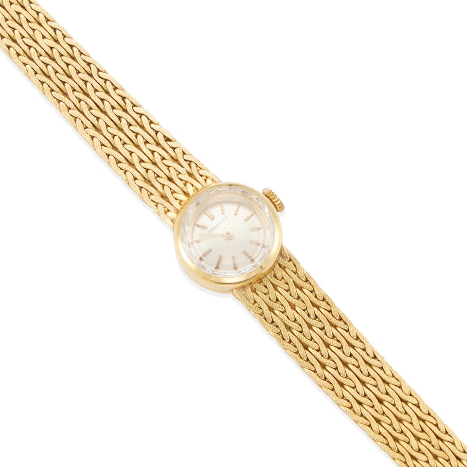 LONGINES: AN 18K GOLD WRISTWATCH: LONGINES: AN 18K GOLD WRISTWATCH • 18k yellow gold • Dial, movement and case signed Longines • Manual movement • Round dial with stick hour markers • Case diameter 15mm &