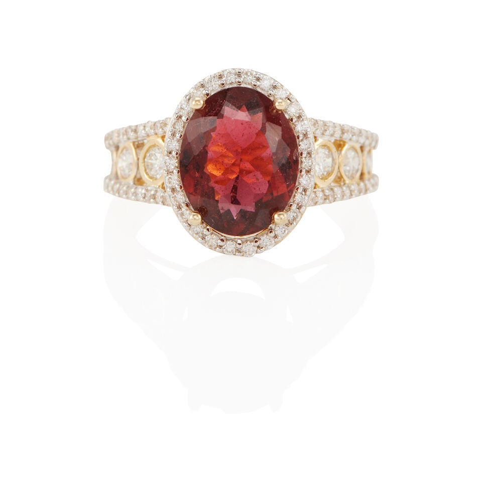 14K GOLD, TOURMALINE AND DIAMOND RING: 14K GOLD, TOURMALINE AND DIAMOND RING • 14k yellow gold • 1 oval=shaped tourmaline weighing approximately 2.50 carats • Numerous round diamonds weighing approximately 0.70 carat tota