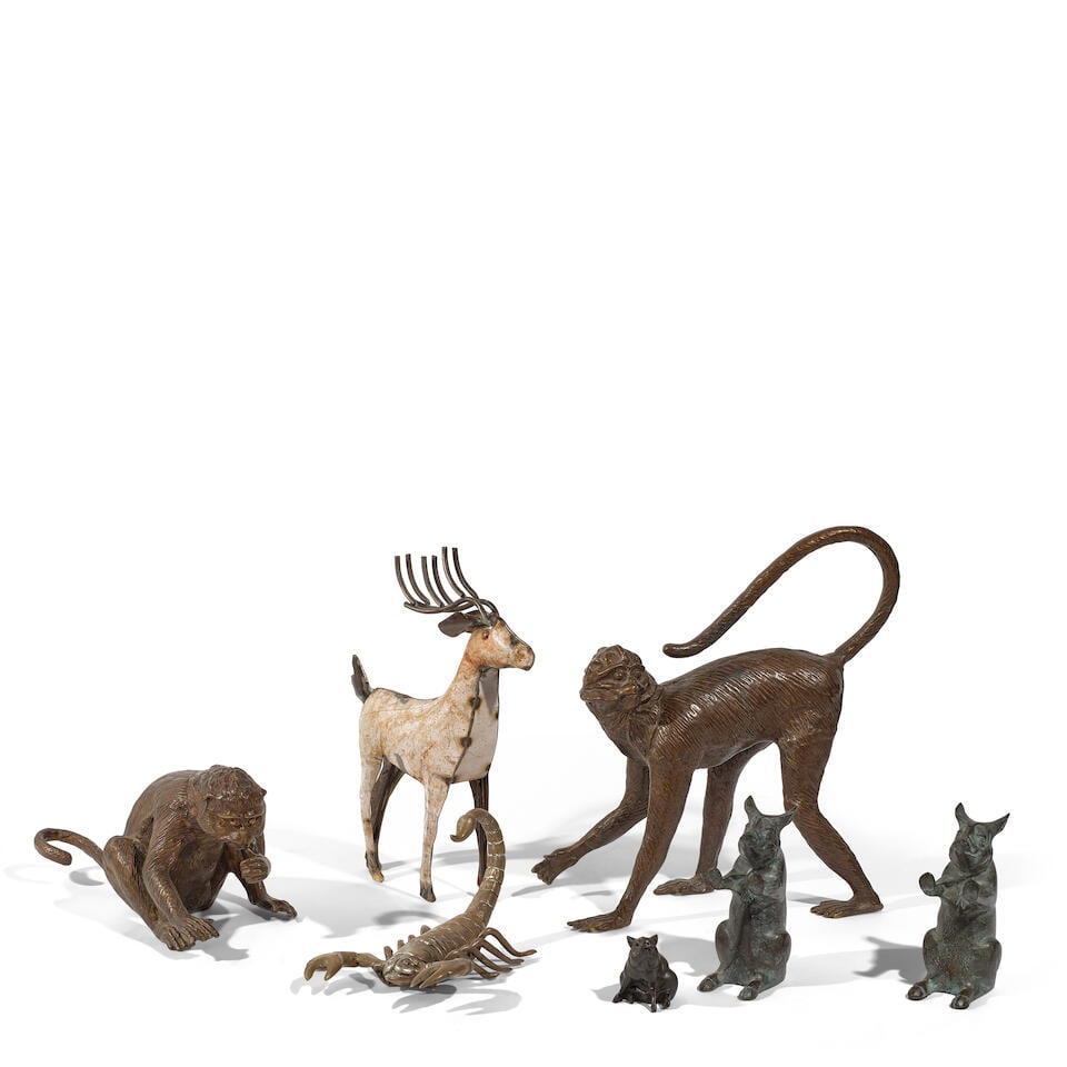 A GROUP OF BRONZE AND METAL DECORATIVE FIGURES OF ANIMALS20th century: A GROUP OF BRONZE AND METAL DECORATIVE FIGURES OF ANIMALS 20th century Comprising two patinated bronze monkeys, a painted metal deer, a brass scorpion, a pair of patinated bronze 'dancing pig' bookend