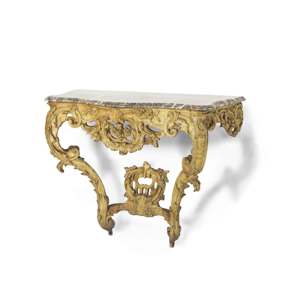 Console mouvementée en bois doré et sculpté du milieu du XVIIIe siècle. A Lo...: Console mouvementée en bois doré et sculpté du milieu du XVIIIe siècle. A Louis XV carved and giltwood console, mid-18th century With a pierced floral and foliate rocaille frieze w