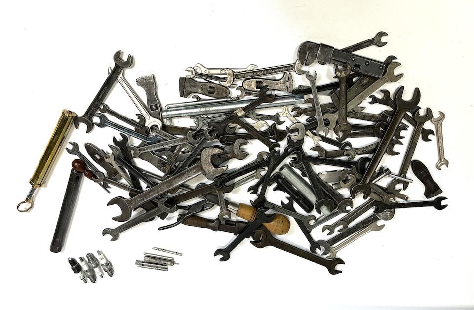 Automotive Tools – JAGUAR and Others: Automotive Tools – JAGUAR and Others Large set of wrenches, spark plugs, a grease pump, and pliers. The set was used for Jaguar automobiles but may also be suitable for other makes. Outillage au