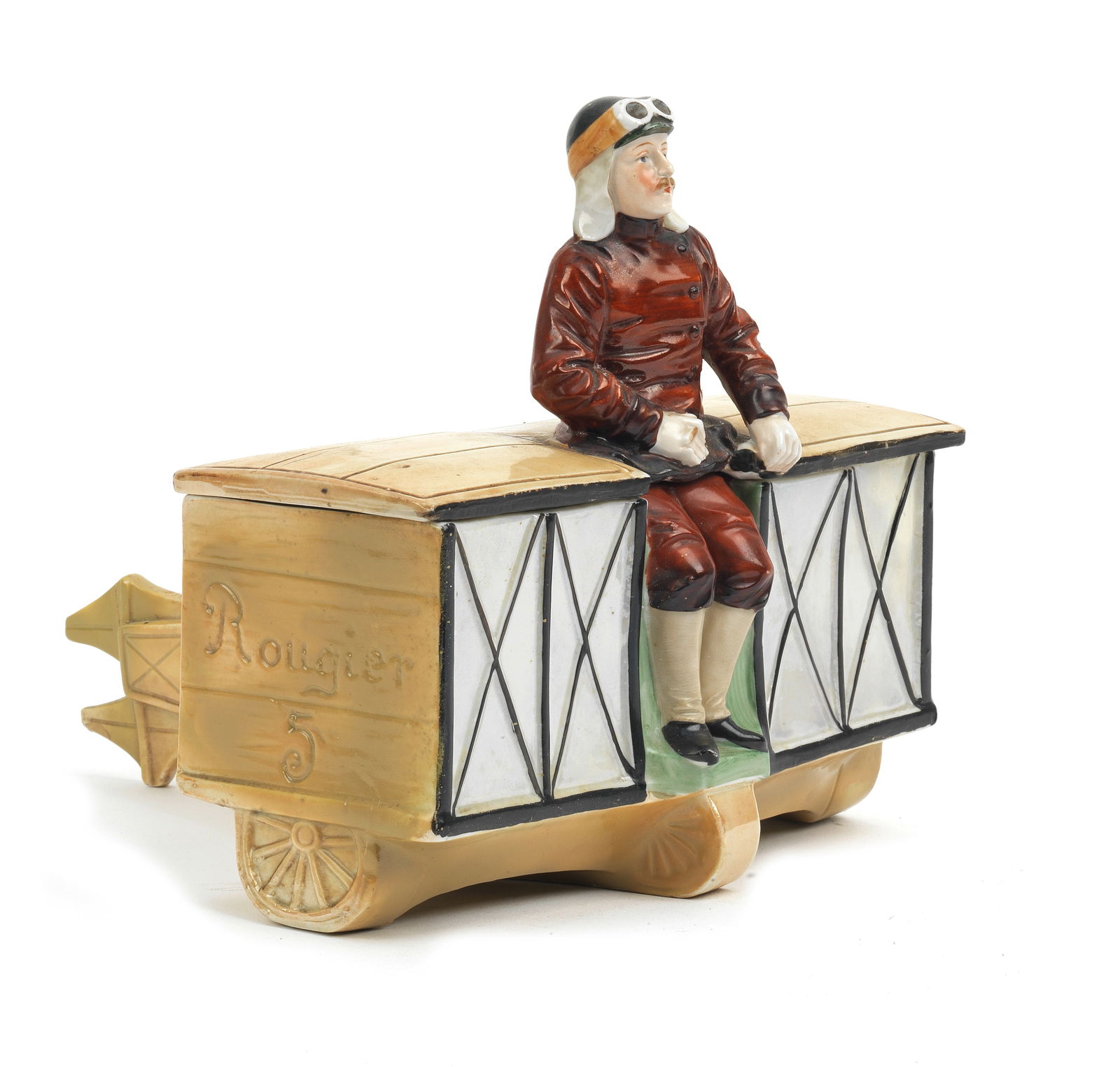 A 'Rougier 5' ceramic biplane trinket box, circa 1909,: A 'Rougier 5' ceramic biplane trinket box, circa 1909, hand-decorated depiction of Henri Rougier's Voisin biplane, top wing lifts as lid, 18cm wide, (tail cracked with old repair). Footnotes: Henri Lo