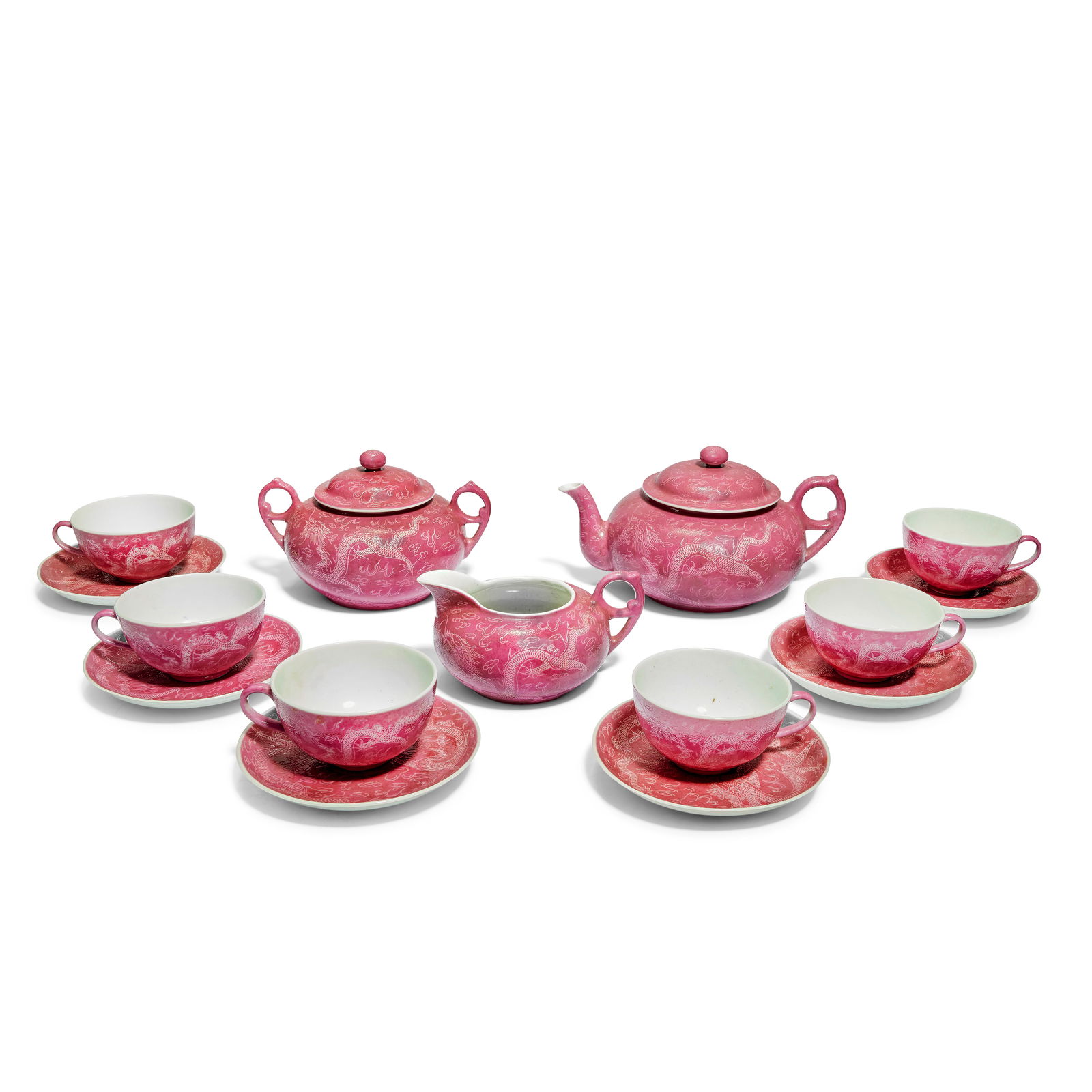 A PUCE GROUND SGRAFFIATO TEA SET Lee Wah Porcelain Company, iron red Qianlong six-character mark...: A PUCE GROUND SGRAFFIATO TEA SET Lee Wah Porcelain Company, iron red Qianlong six-character marks, Republic period Comprising: a teapot and cover, sugar bowl and cover, milk jug, six tea cups and sauc