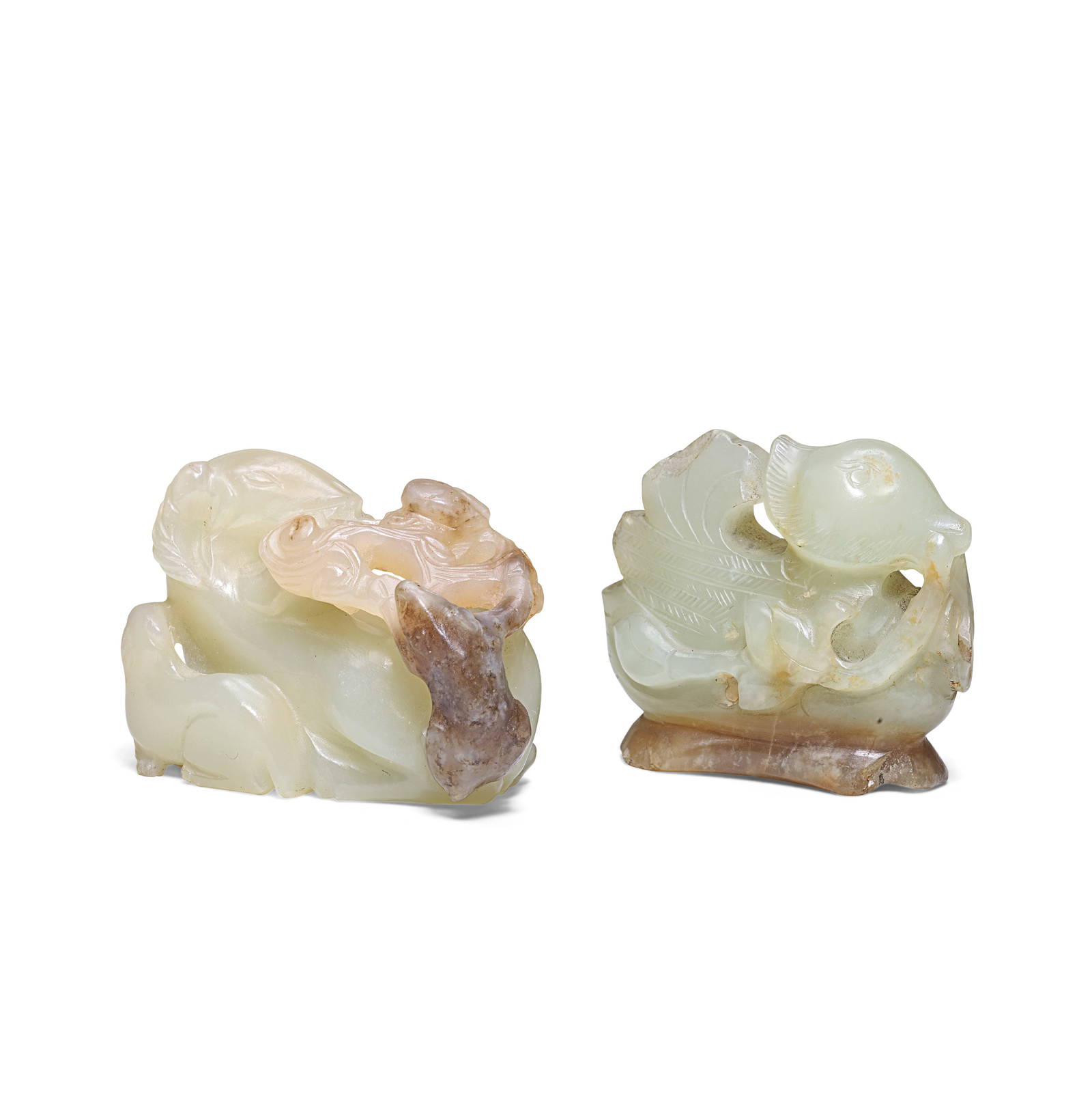 A PALE GREEN JADE 'MANDARIN DUCK' CARVING AND A PALE JADE 'RAM' CARVING 18th/19th century (2)