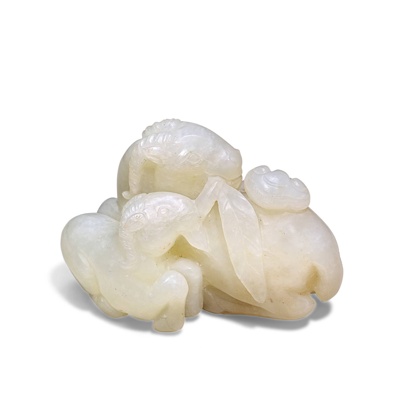 A WHITE JADE CARVING OF A RAM AND YOUNG 18th/19th century