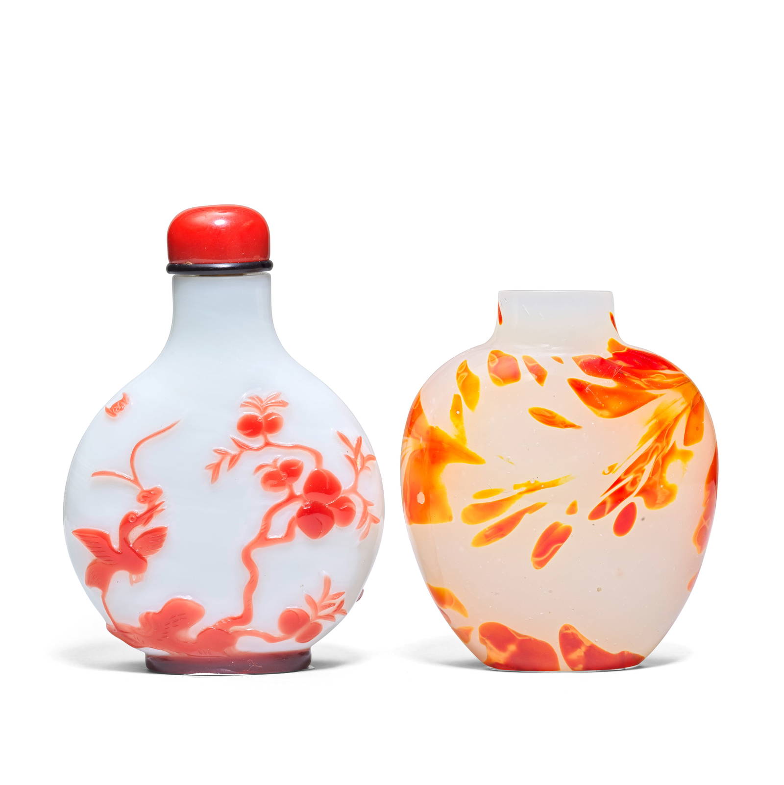 A RED OVERLAY GLASS SNUFF BOTTLE AND A 'SANDWICH' GLASS SNUFF BOTTLE 19th century (3)