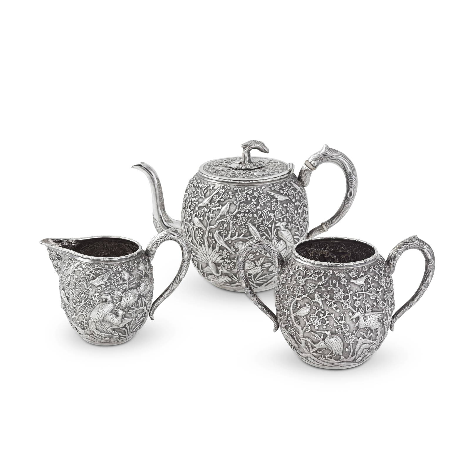 A VERY FINE CHINESE EXPORT SILVER 'HUNDRED BIRDS' THREE-PIECE TEA SERVICE By Wang Hing & Co., Ho...