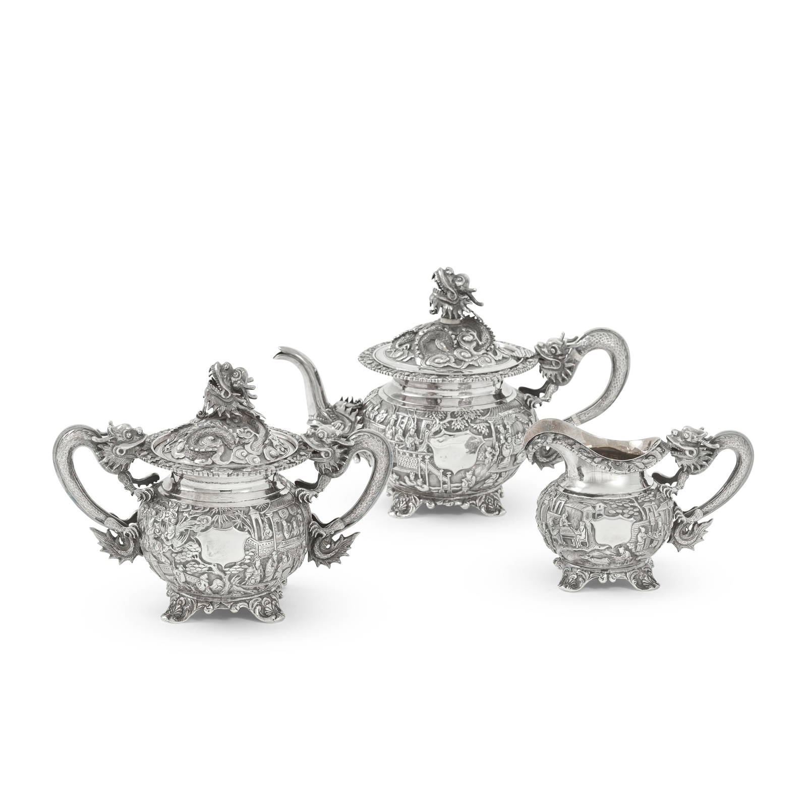 A CHINESE EXPORT THREE-PIECE SILVER TEA SERVICE Late 19th/early 20th century (4)