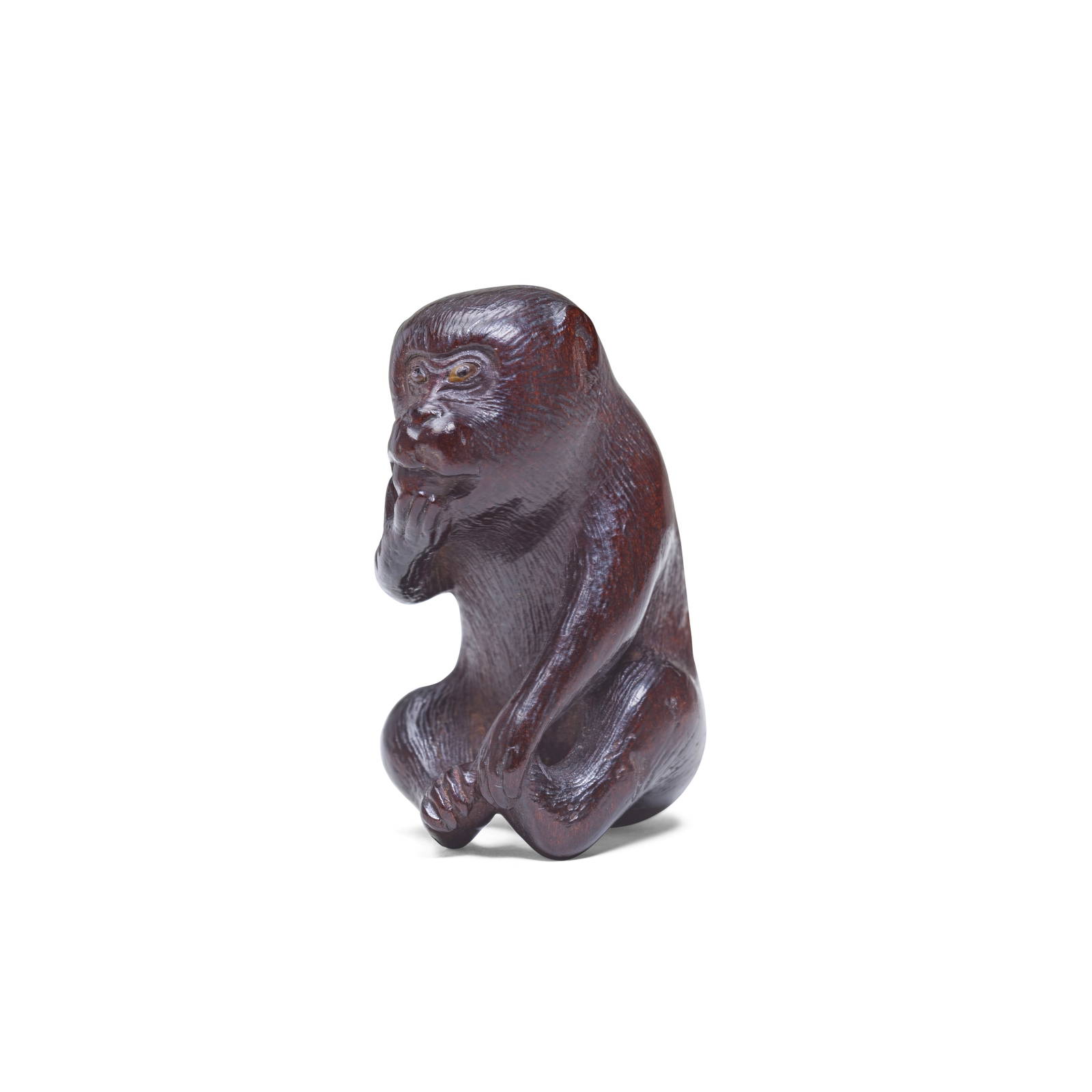 A WOOD NETSUKE OF A MONKEY By Hakuryu, 19th century