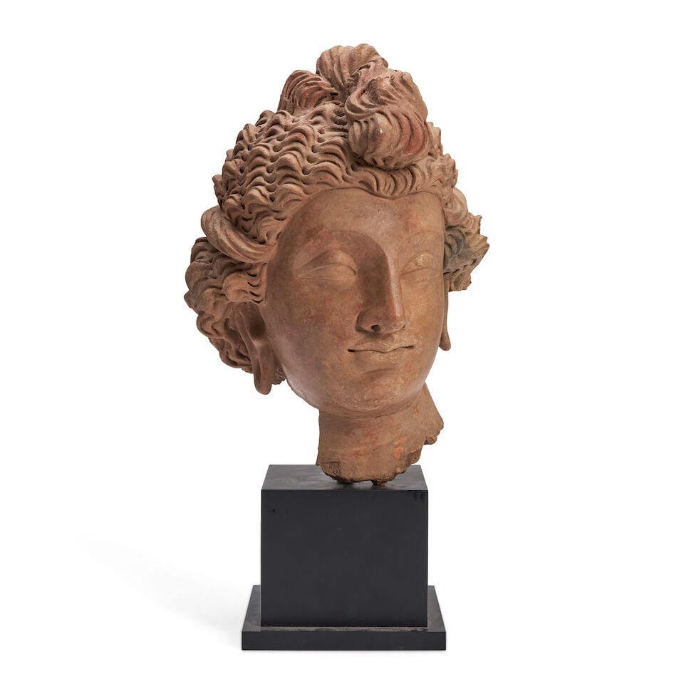 A TERRACOTTA HEAD OF A YOUTHFUL BODHISATTVA Gandharan style, (1 of 3)
