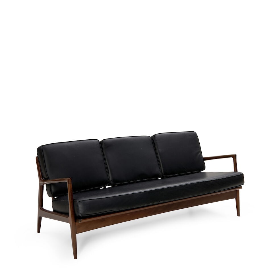 IB KOFOD-LARSEN (1921-2003) FOR SELIG THREE-SEAT SOFA Denmark, c. 1955, walnut, leather upholste...: IB KOFOD-LARSEN (1921-2003) FOR SELIG THREE-SEAT SOFA Denmark, c. 1955, walnut, leather upholstery, maker's round metal label, ht. 31, seat ht. 19, wd. 74, dp. 30 in. Footnotes: OVERALL CONDITION: Cre