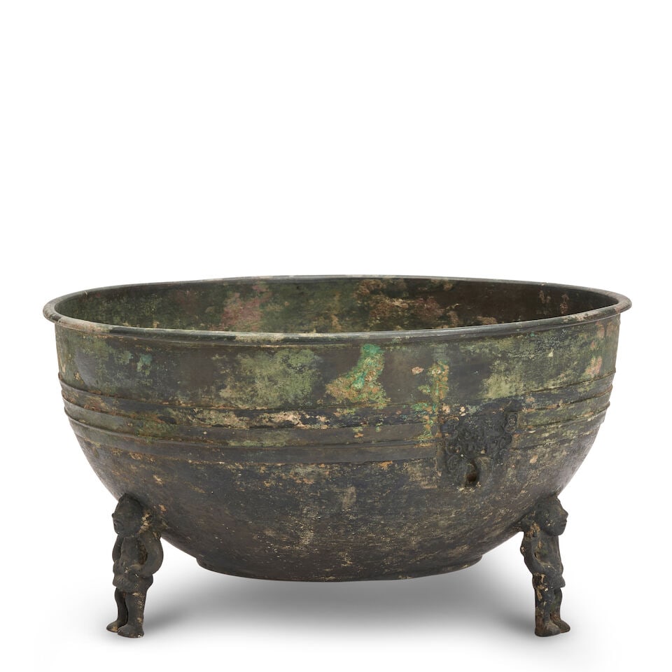 A CAST BRONZE FOOTED BASIN China, Han style, (1 of 2)