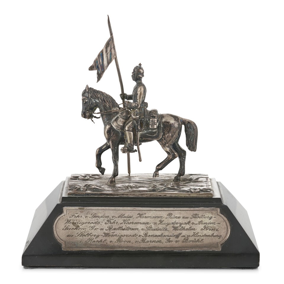 Silver Commemorative Paperweight,: Silver Commemorative Paperweight, featuring a man on horseback carrying a flag, the marble base mounted with German inscription on plaques, ht. to top of flag 6 1/2, lg. 5 3/4; dp. 4 in. For further