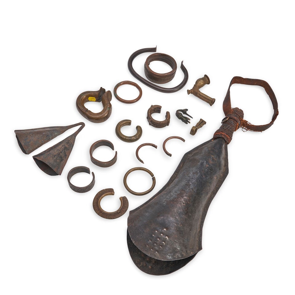 COLLECTION OF AFRICAN BRASS CURRENCY: COLLECTION OF AFRICAN BRASS CURRENCY The various sized rings with holders and a sheath. Footnotes: OVERALL CONDITION: Good/Fair. Damage and loss throughout. Lot to be sold without reserve. This lot is