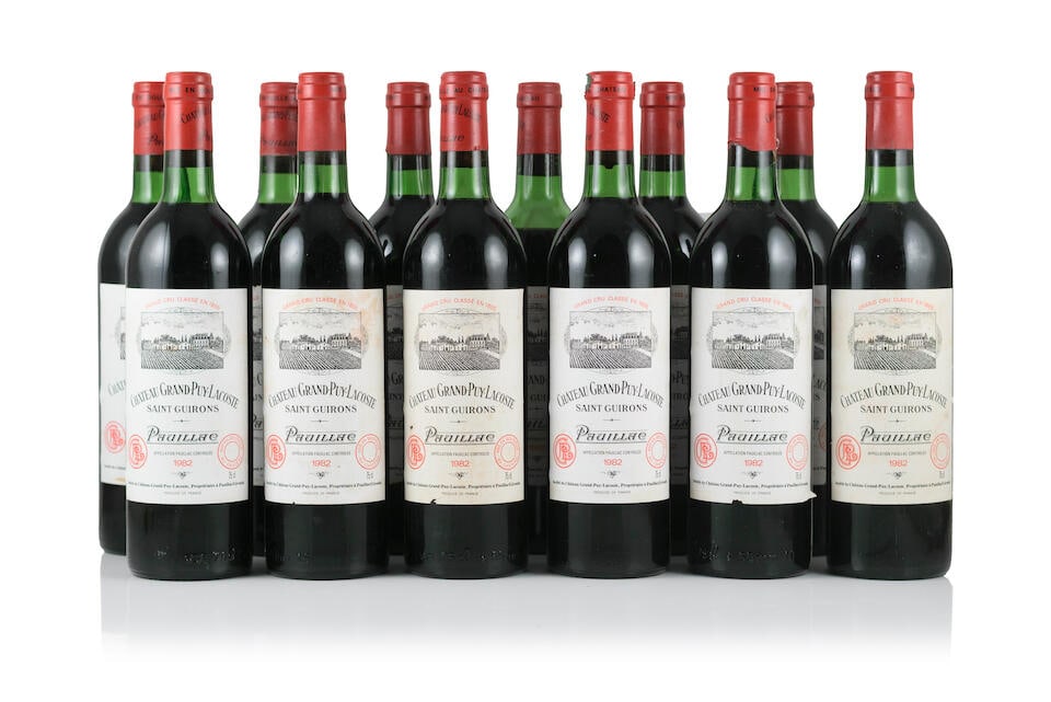Château Grand Puy Lacoste, 1982 (12 x 750ml): Château Grand Puy Lacoste, 1982 (12 x 750ml) Region: Pauillac Fill Level: 4 into neck, 7 very top, 1 mid shoulder Capsule: 1 torn capsule Label: bin-soiled, damp-stained & slightly worn labels -