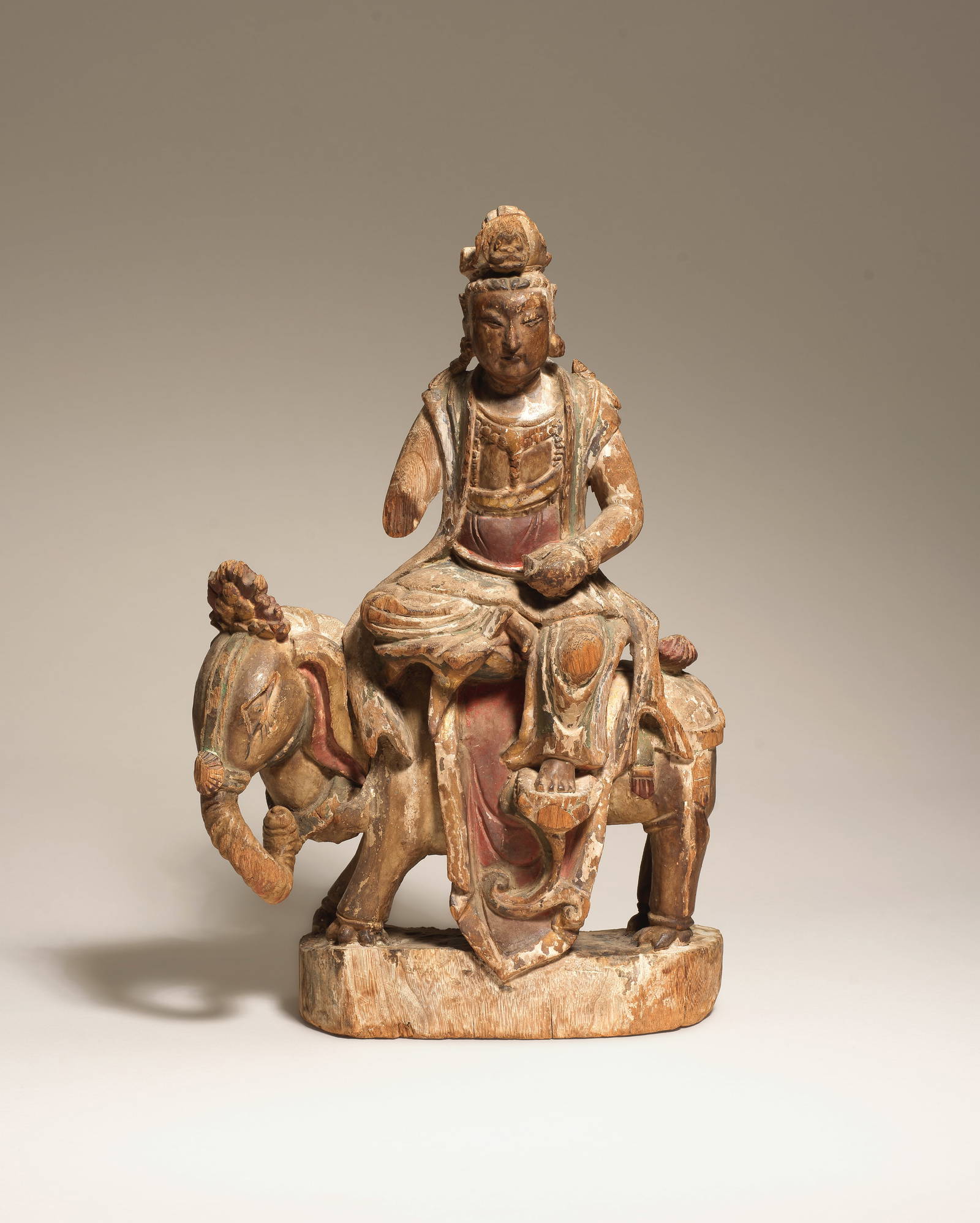A RARE POLYCHROME CARVED WOOD FIGURE OF SAMANTABHADRA ON AN ELEPHANT 13th-15th century