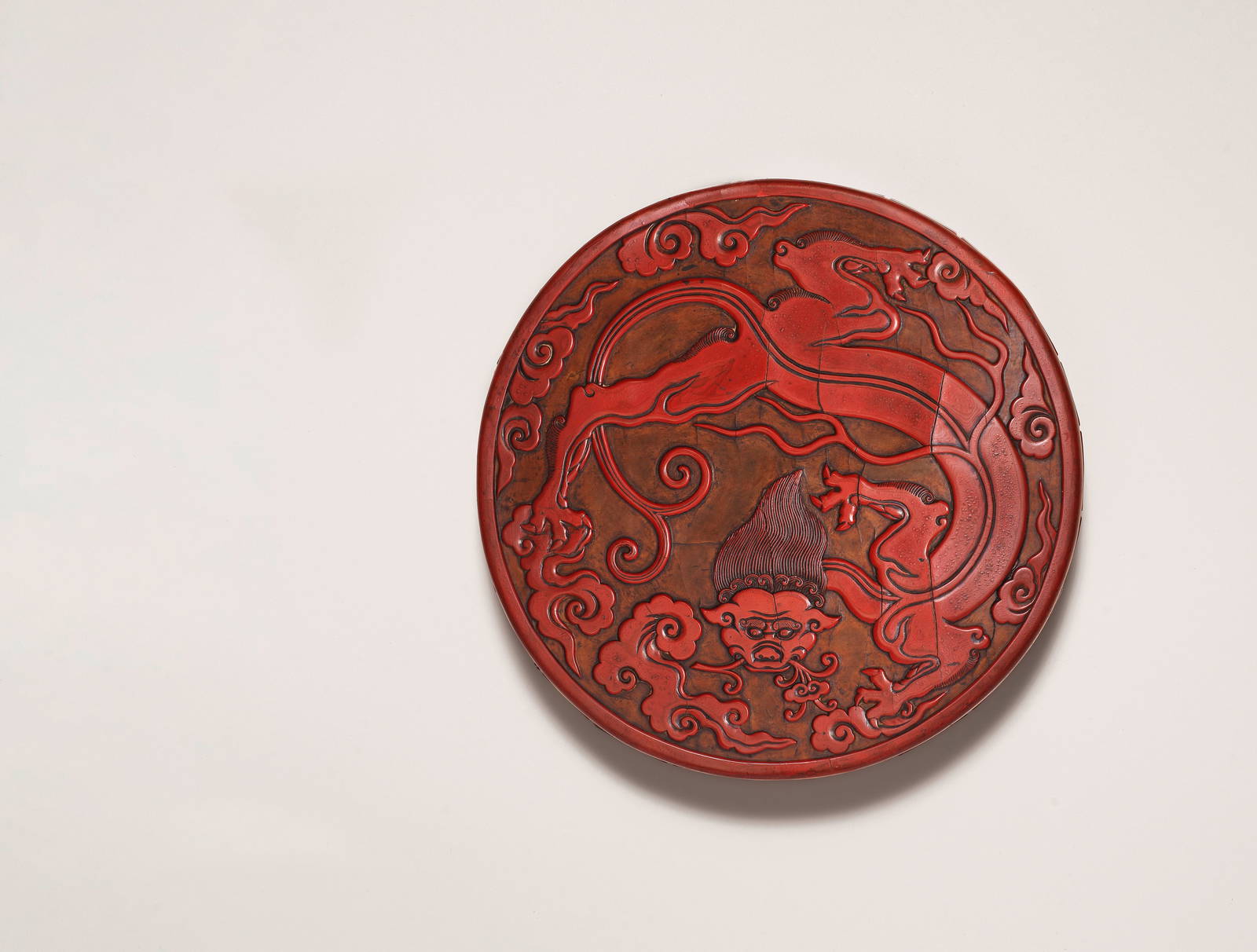 AN EXCEPTIONALLY RARE AND LARGE CARVED CINNABAR LACQUER YELLOW-GROUND 'CHILONG' BOX AND COVER 13...