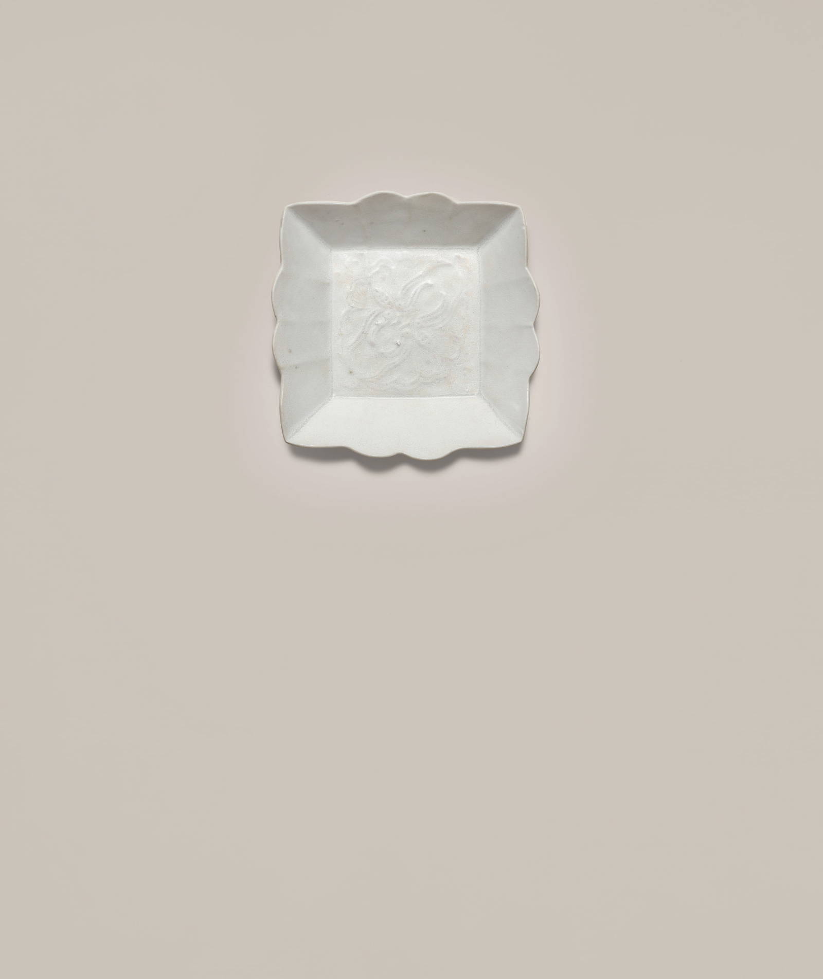 A VERY RARE DINGYAO WHITE-GLAZED SQUARE 'BUTTERFLY' DISH Guan incised character, late Tang Dynas...