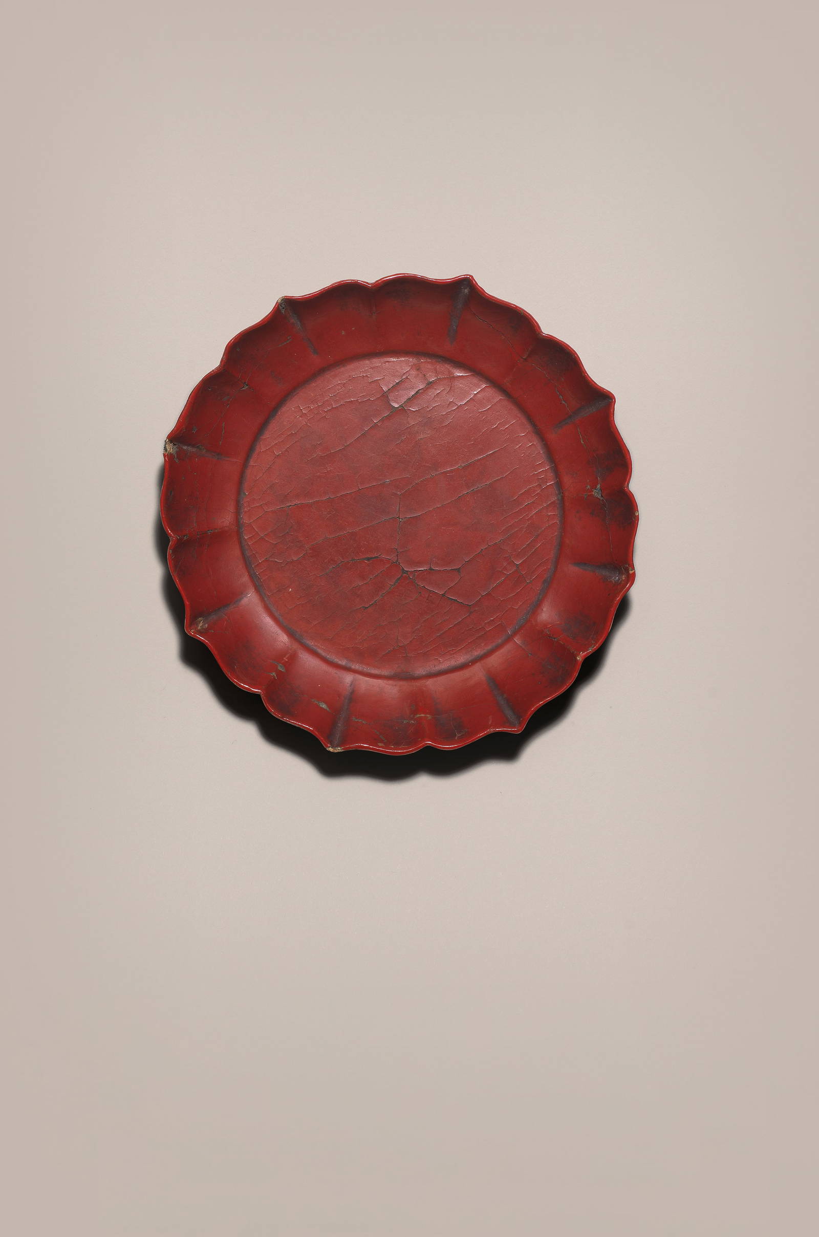 A RARE CINNABAR LACQUER FOLIATE-RIM DISH Nanyang jianji four-character mark, Southern Song/Yuan ...