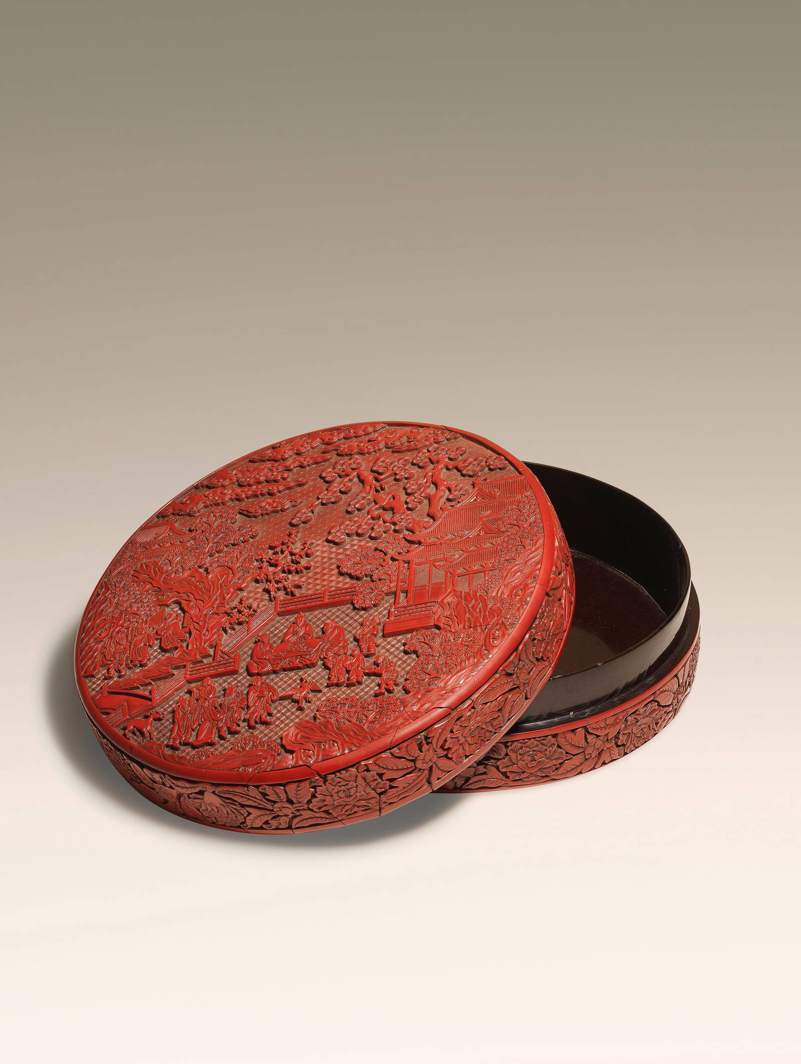 AN IMPORTANT AND VERY LARGE CARVED CINNABAR LACQUER 'DAOIST IMMORTALS' BOX AND COVER Yongle six-...