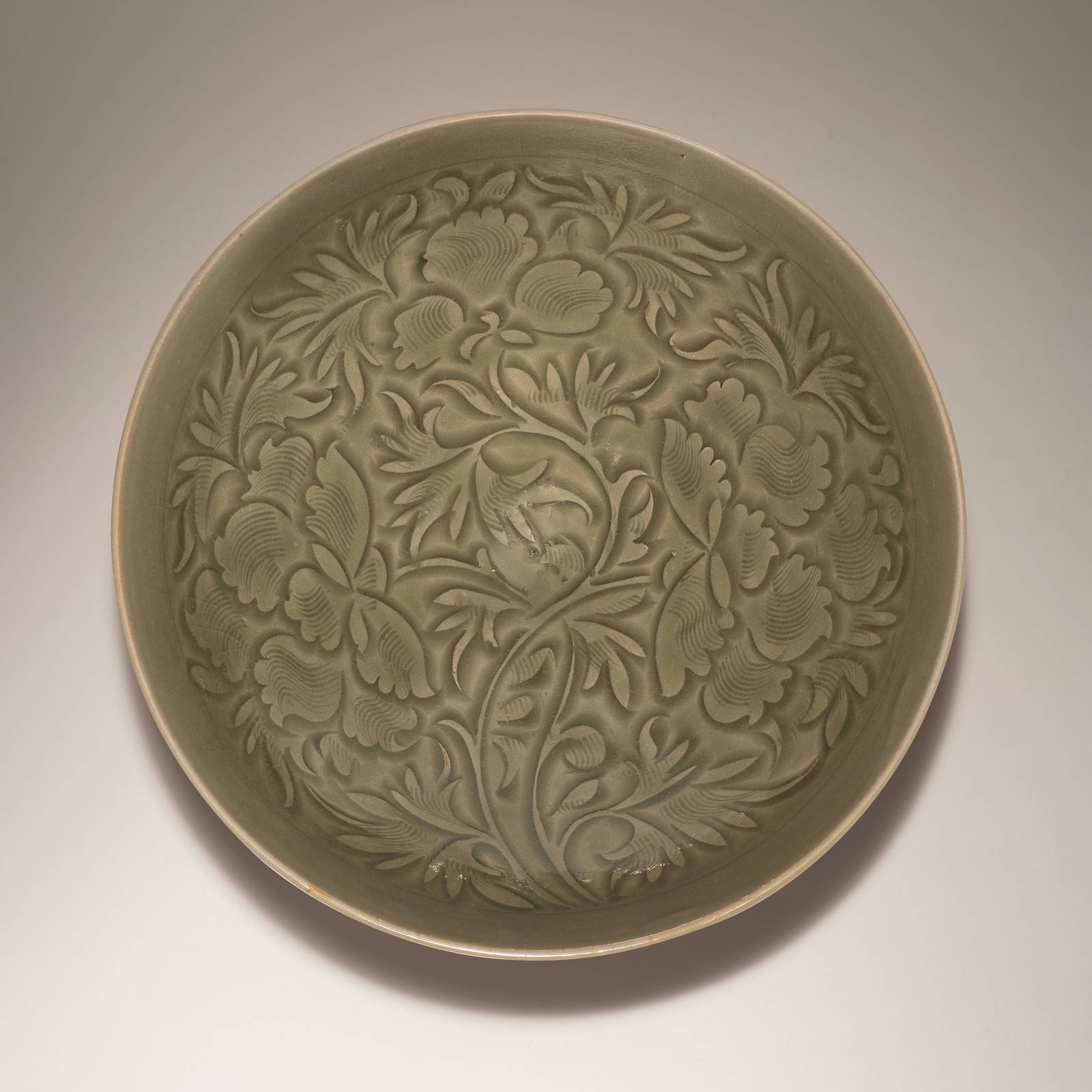 AN EXCEPTIONAL YAOZHOU CELADON-GLAZED CARVED 'PEONIES' BOWL Northern Song Dynasty (2)