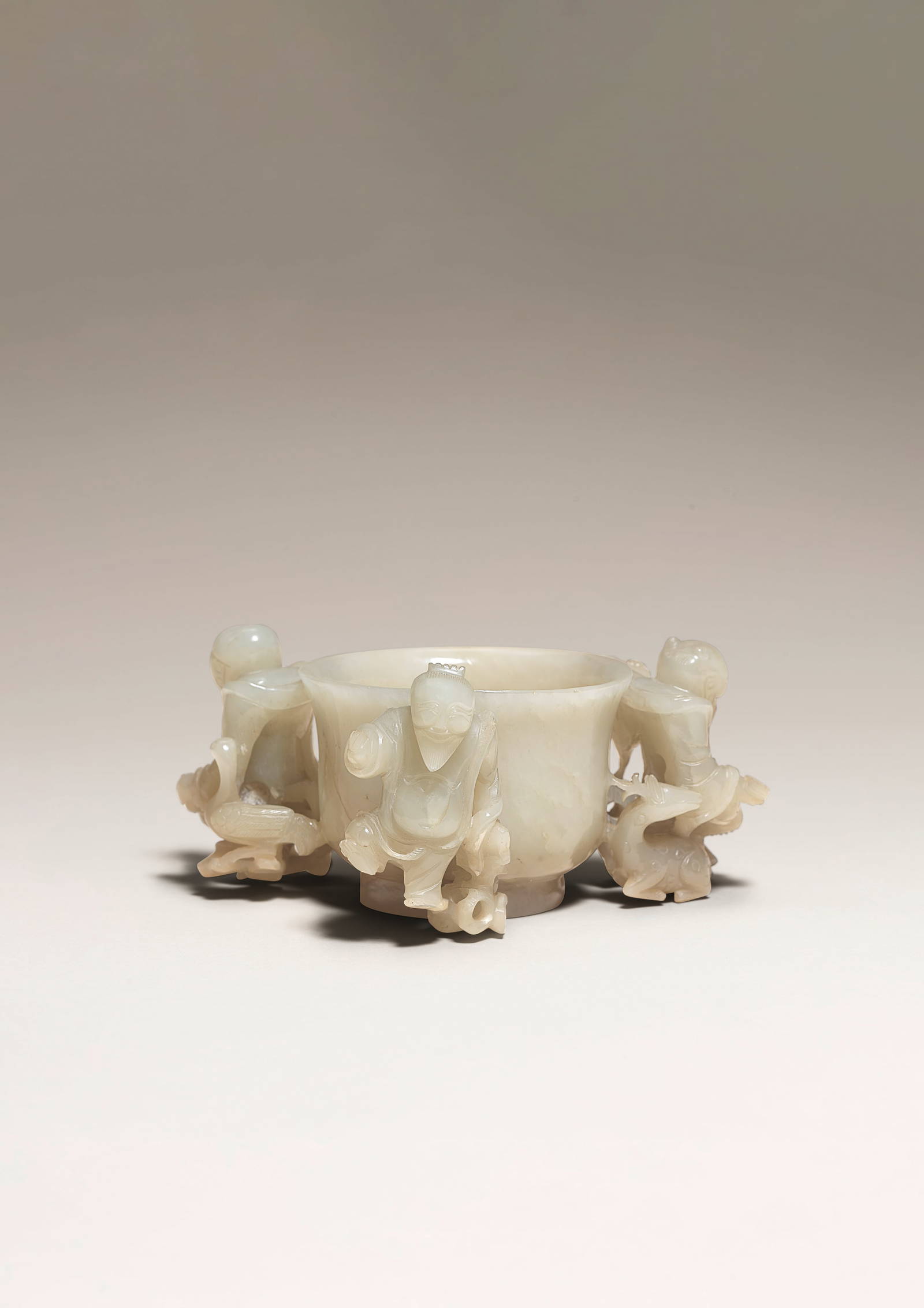 A RARE PALE GREEN AND RUSSET JADE 'IMMORTALS AND SHOU-CHARACTER' CUP Ming Dynasty (2)