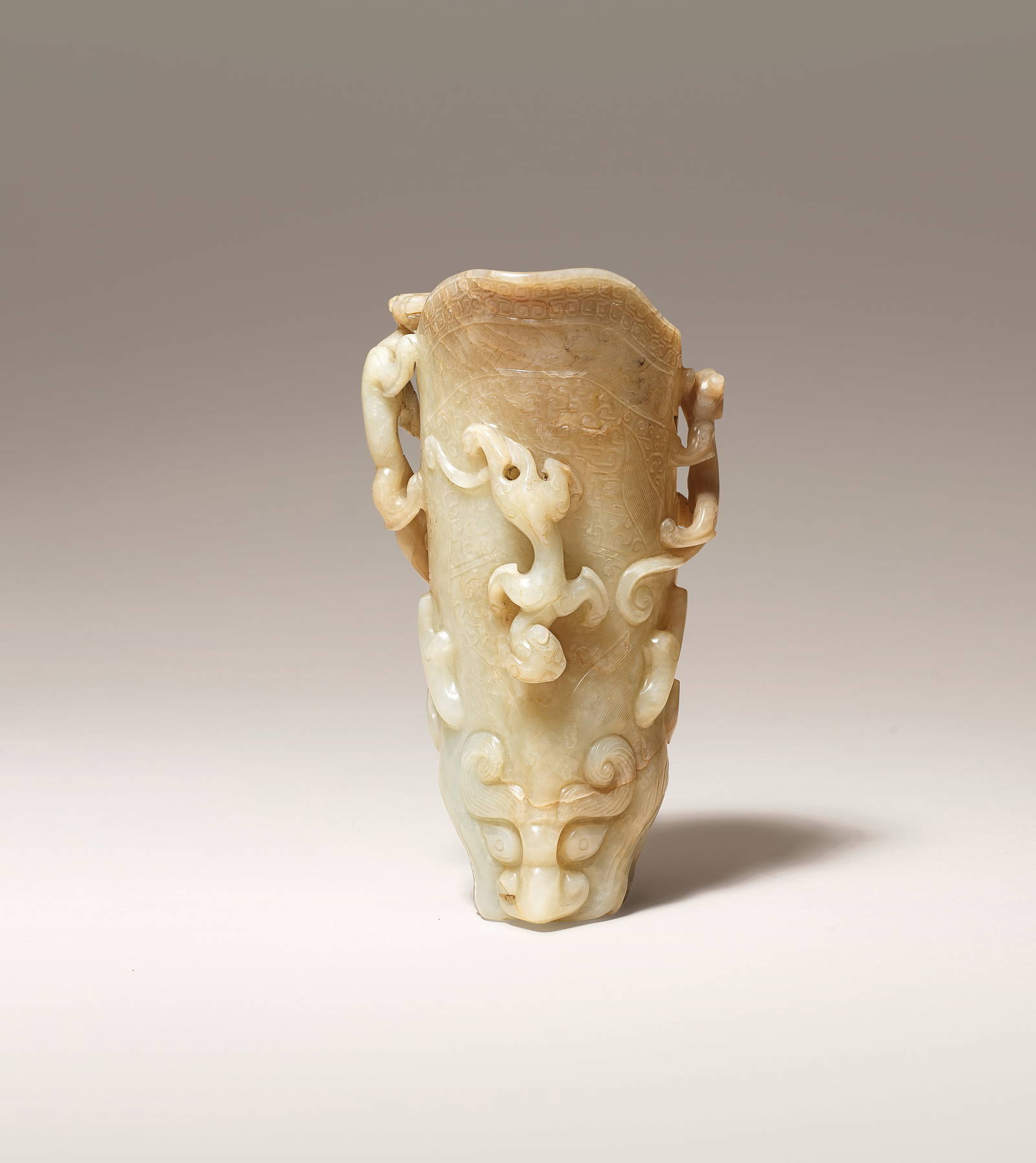 A RARE PALE GREEN AND RUSSET JADE RHYTON CUP, GONG Yuan/Ming Dynasty (3)