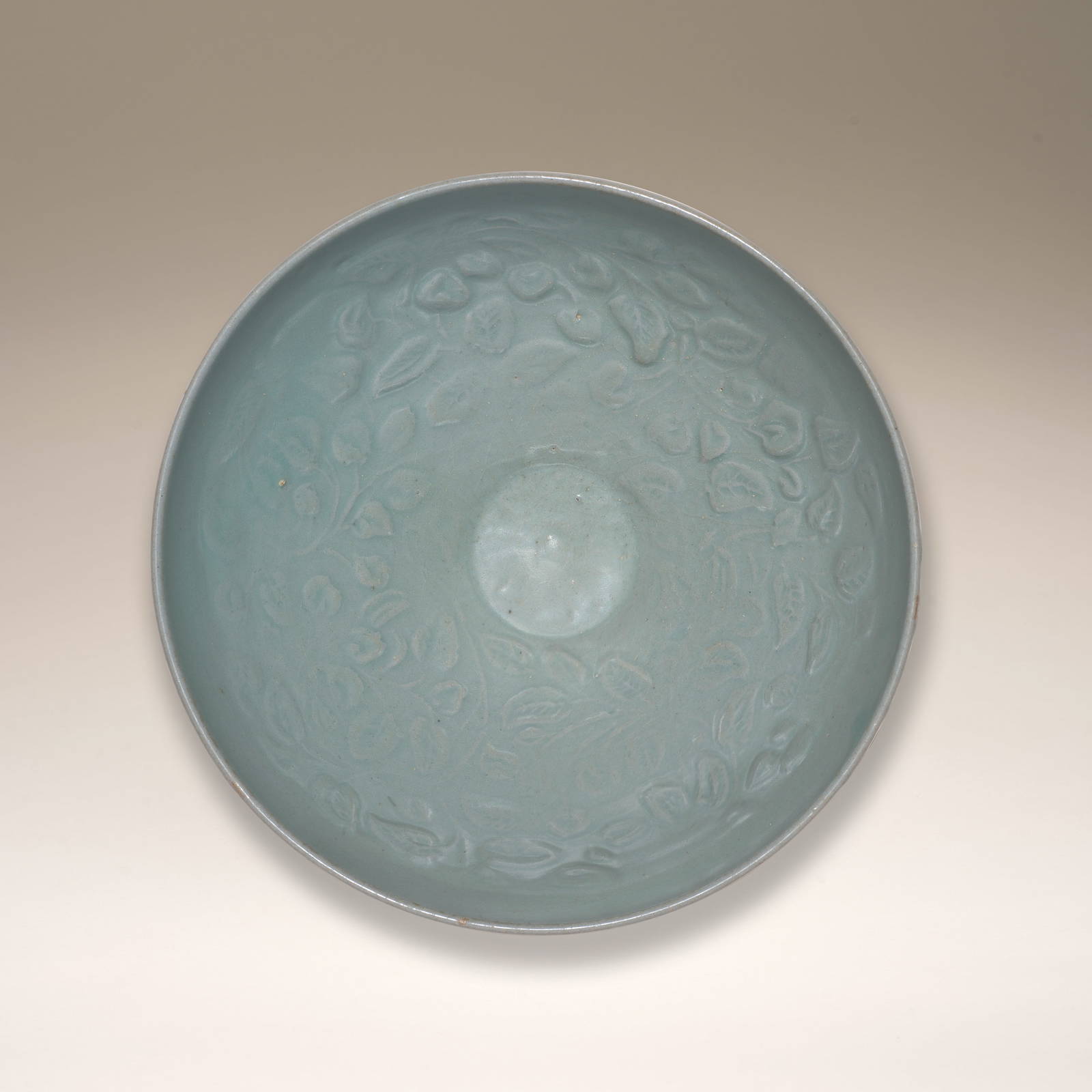 A CELADON-GLAZED MOULDED 'LEAF-SCROLL' BOWL Goryeo Dynasty, 13th century (2)