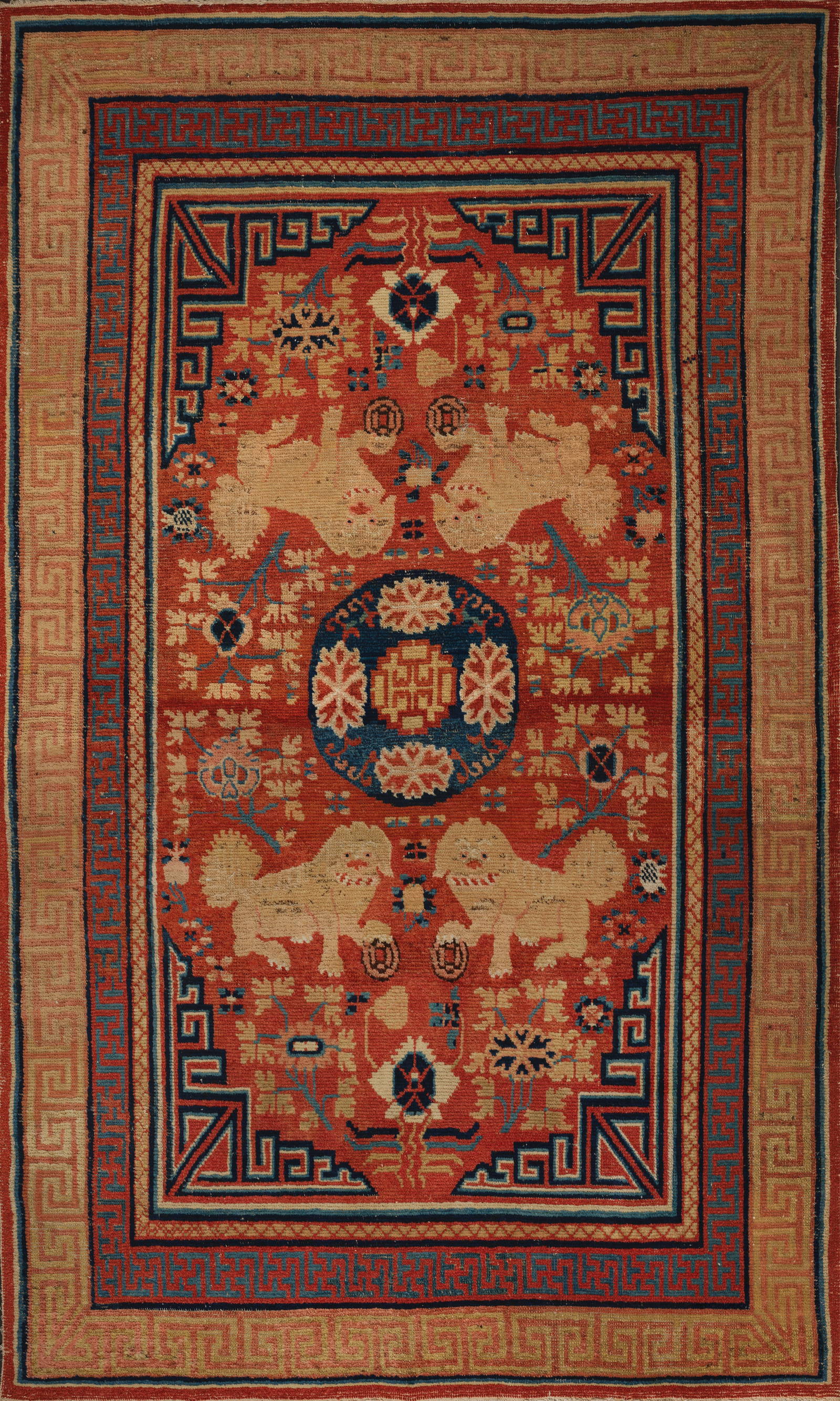 A GANSU 'BUDDHIST LION' WOOL CARPET Late 18th century