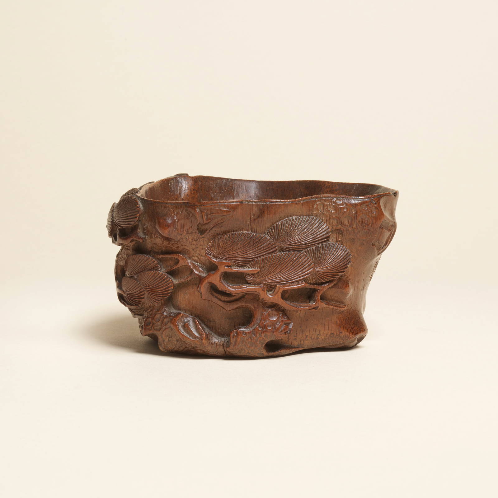 A FINE CARVED BAMBOO 'PINE' LIBATION CUP 17th/18th century