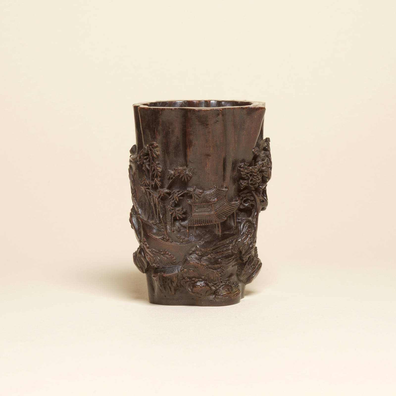 A RARE CARVED CHENXIANGMU 'ROCKY LANDSCAPE' BRUSHPOT, BITONG 17th/18th century