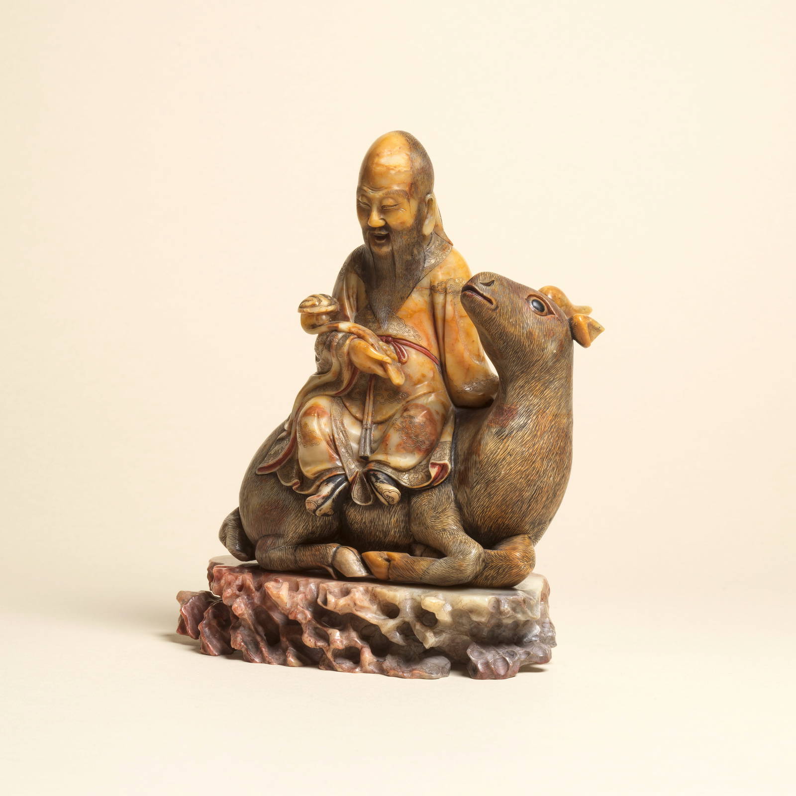 A SOAPSTONE CARVING OF SHOULAO RIDING A LUDUAN 18th century (2)