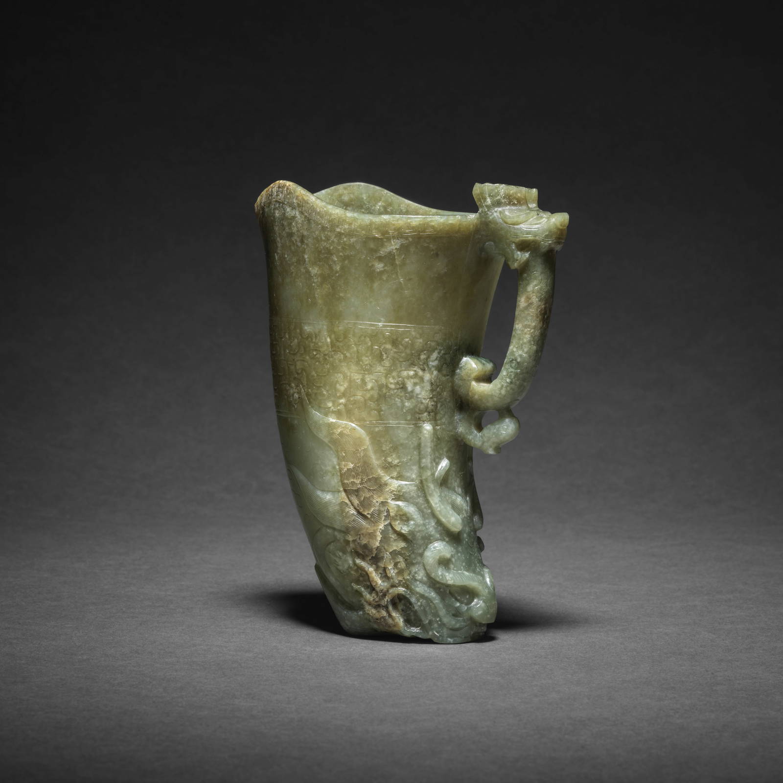 A RARE PALE GREEN AND RUSSET JADE 'DRAGON AND PHOENIX' RHYTON CUP, GONG Ming Dynasty (2)