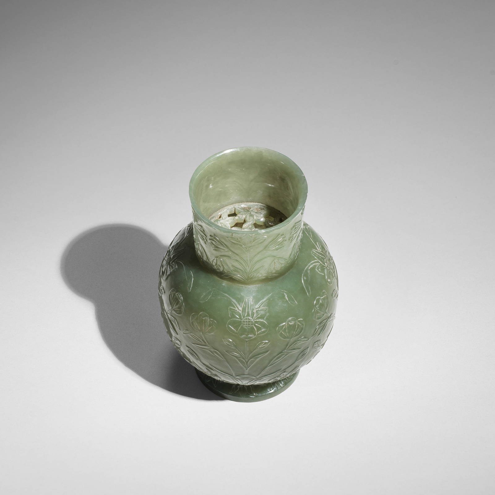 A RARE MUGHAL OLIVE GREEN JADE 'FLORAL' VASE AND OPENWORK STRAINER 18th century