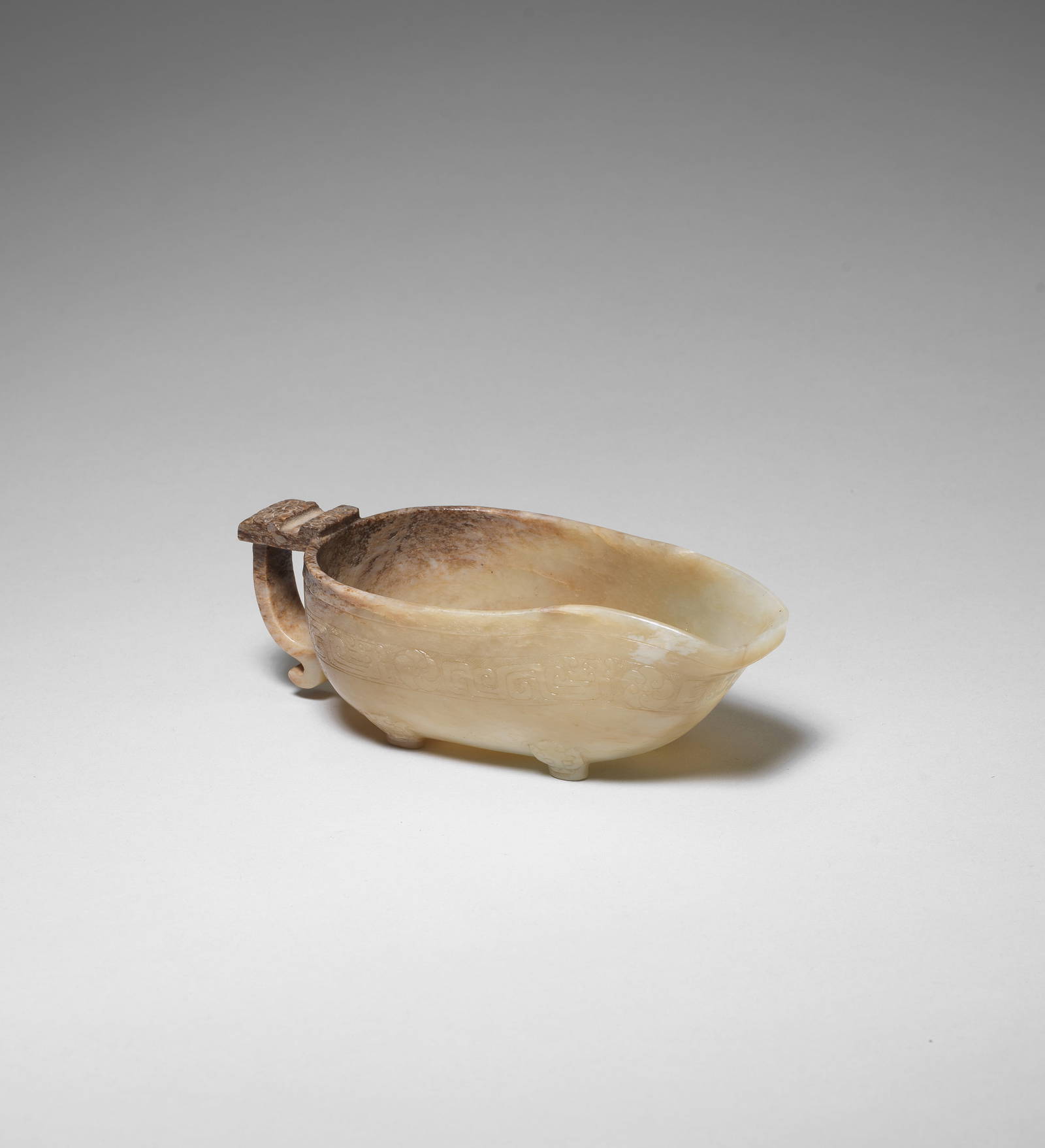AN ARCHAISTIC PALE GREEN AND RUSSET JADE POURING VESSEL, YI Southern Song/Ming Dynasty (2)