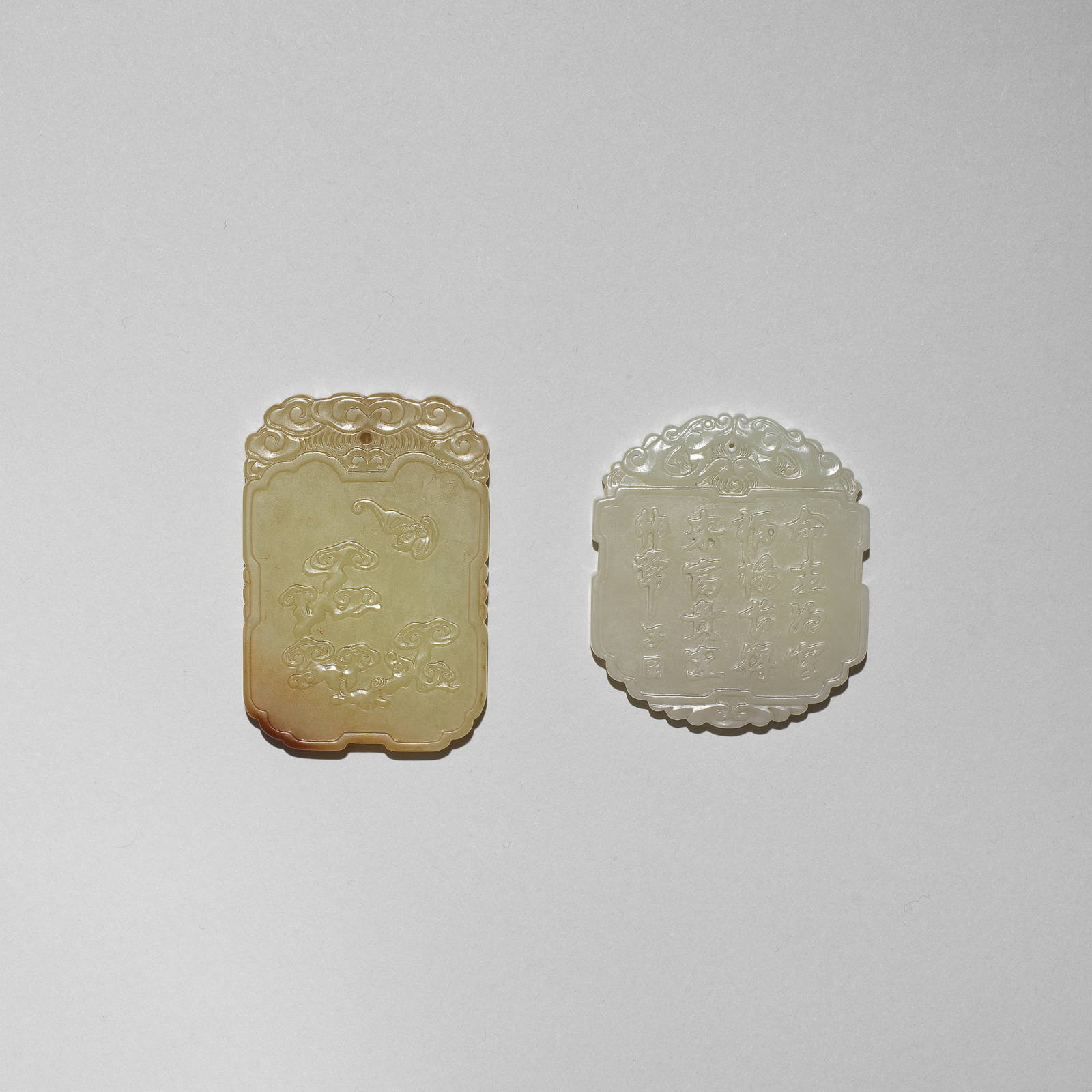 A YELLOW JADE PLAQUE AND A WHITE JADE PLAQUE Qing Dynasty/Republic Period, the white jade plaque...