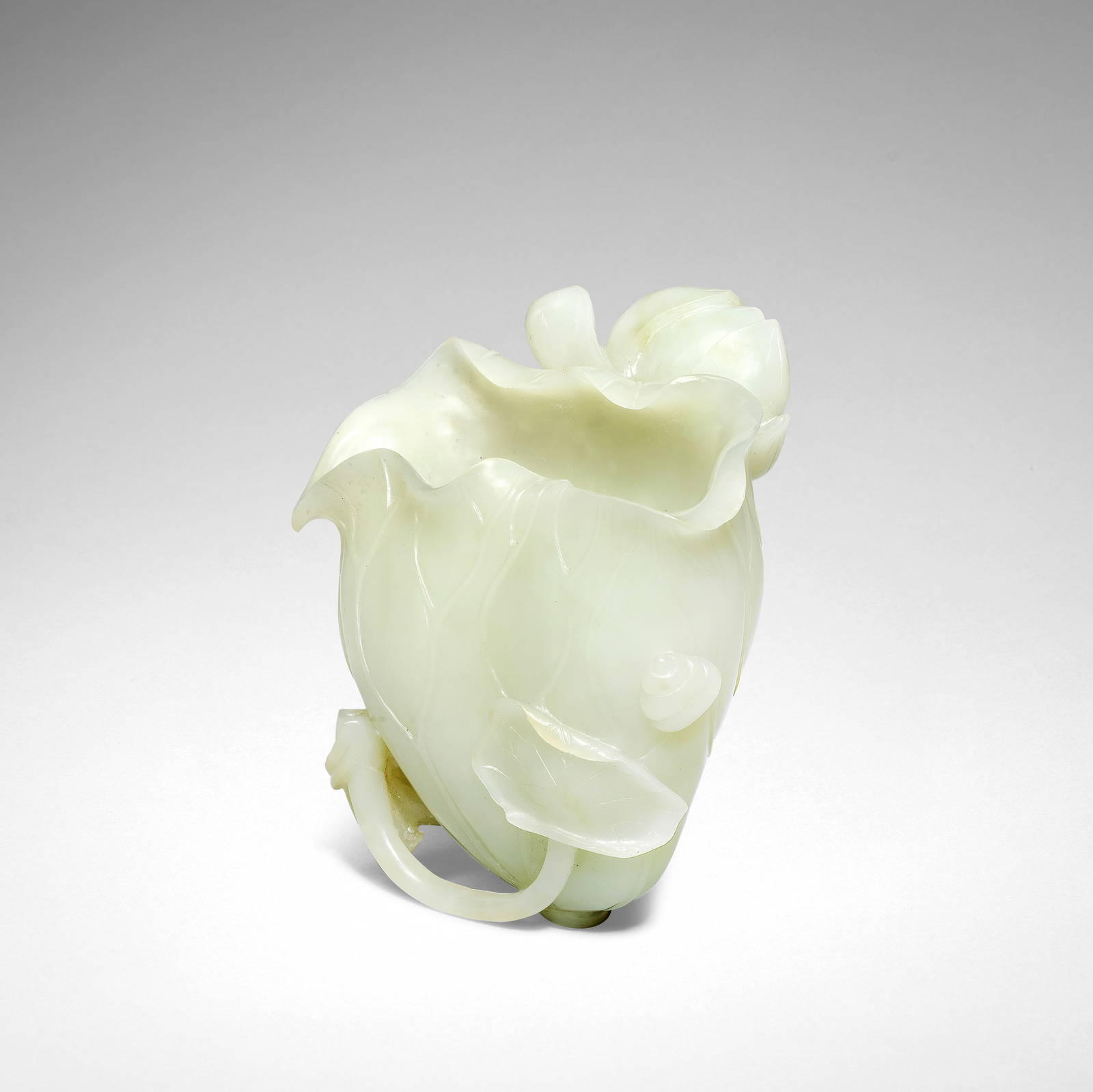 A PALE GREEN JADE 'LOTUS' LIBATION CUP 18th century