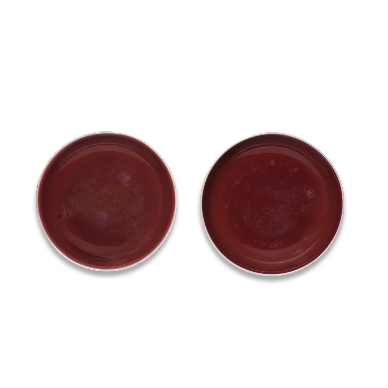 A PAIR OF COPPER-RED-GLAZED DISHES Qianlong seal marks and of the period (2)