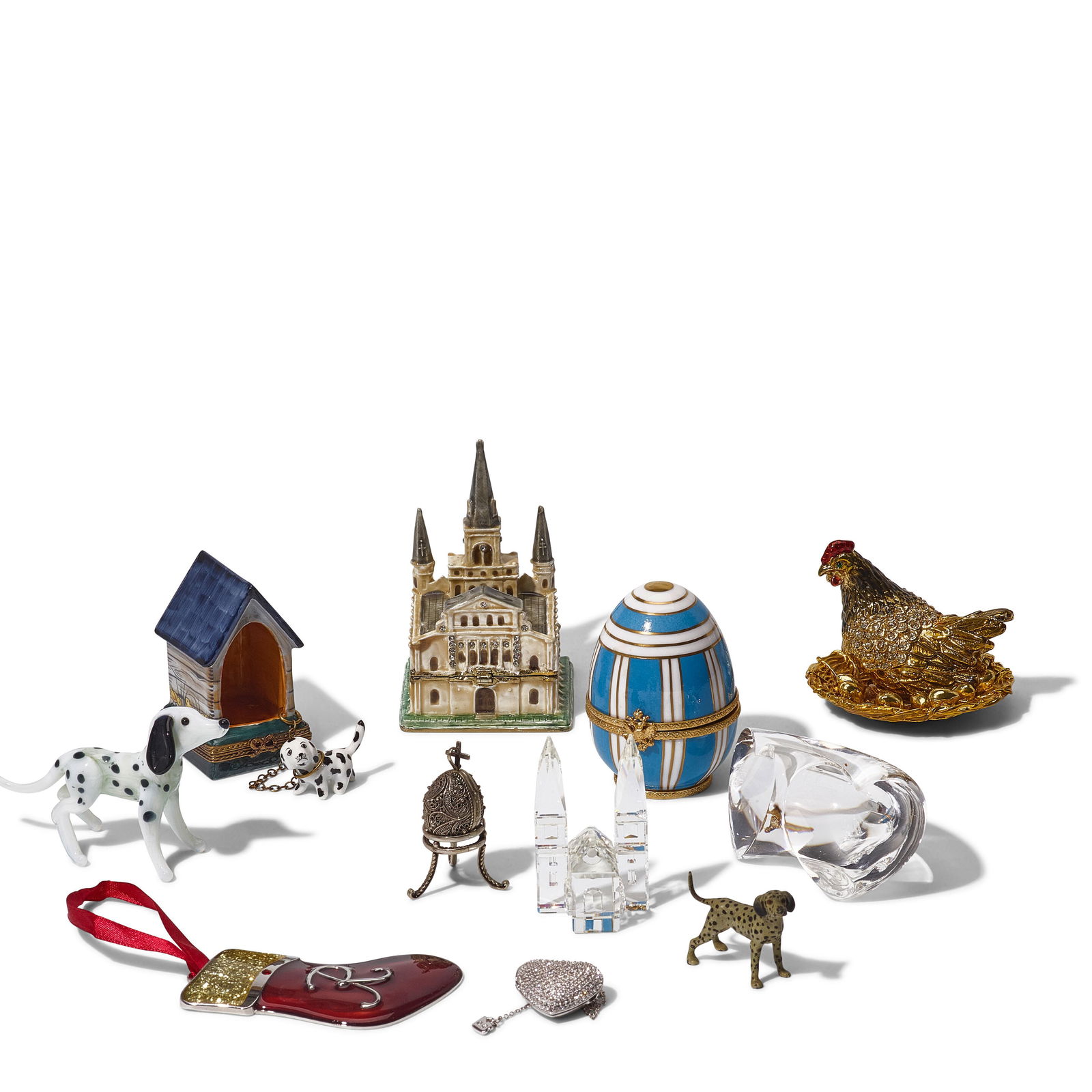 A GROUP OF DECORATIVE OBJECTSby various makers, 20th/21st century: A GROUP OF DECORATIVE OBJECTS by various makers, 20th/21st century Including a Swarovski vase, a Reed & Barton fairy music box, a stocking Christmas ornament inscribed R, and a Limoges doghouse box wi