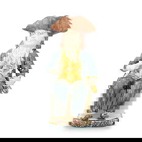 A Portuguese creamware 'Sailor' Toby jug, circa 1790: A Portuguese creamware 'Sailor' Toby jug, circa 1790 Perhaps Fábrica do Rato or Fábrica de Louça de Massarelos, modelled seated, holding a flask in his left hand and a cup in his right,