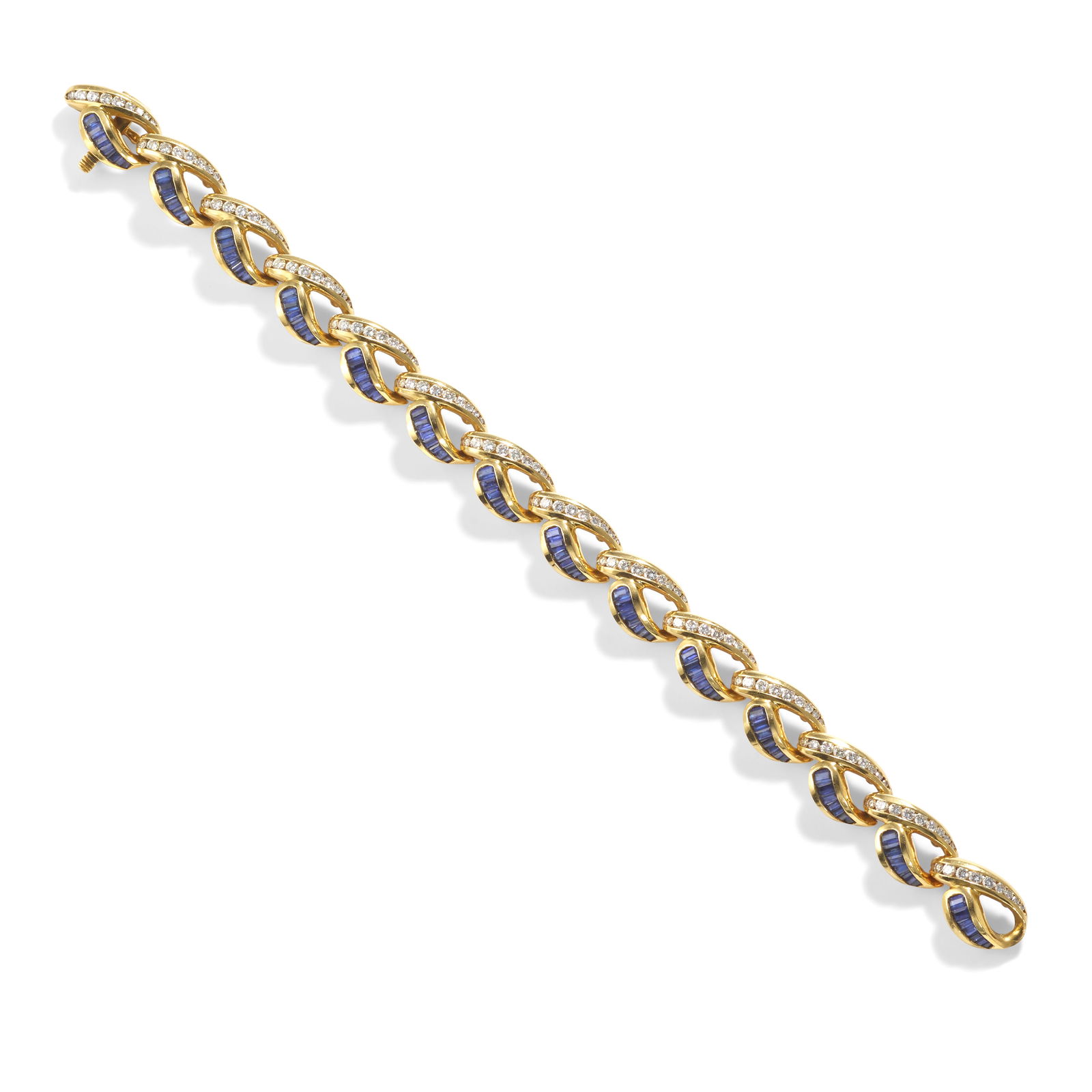 CHARLES KRYPELL: AN 18K GOLD, DIAMOND AND SAPPHIRE BRACELET: CHARLES KRYPELL: AN 18K GOLD, DIAMOND AND SAPPHIRE BRACELET A fancy link bracelet, each link set with round diamonds weighing approximately 2.00 carats and baguette-cut sapphires weighing approximatel