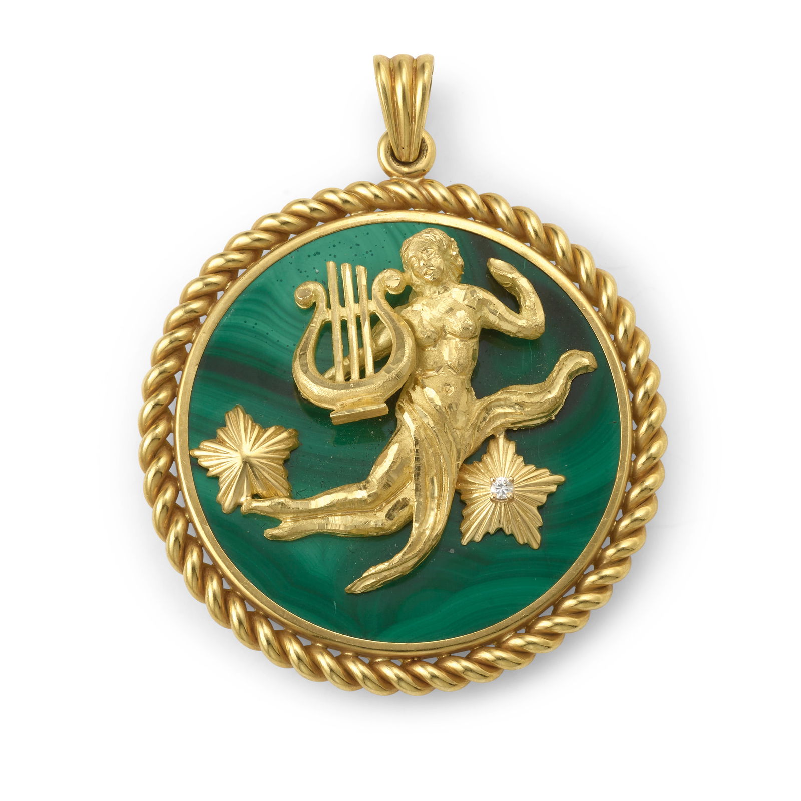 VAN CLEEF & ARPELS: AN 18K GOLD, MALACHITE AND DIAMOND 'VIRGO' ENHANCER PENDANT, CIRCA 1970: VAN CLEEF & ARPELS: AN 18K GOLD, MALACHITE AND DIAMOND 'VIRGO' ENHANCER PENDANT, CIRCA 1970 Centering a sculptural depiction of Virgo with a lyre, ascending between two stars, one accented with a sing