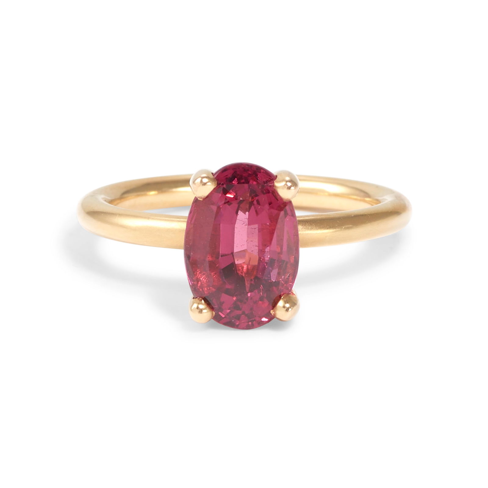 AN 18K ROSE GOLD AND PINK SPINEL RING: AN 18K ROSE GOLD AND PINK SPINEL RING Centering an elongated oval-shaped spinel weighing approximately 3.25 carats, size 6 1/2 Footnotes: OVERALL CONDITION: Metal tested with XRF (X-ray fluorescence)