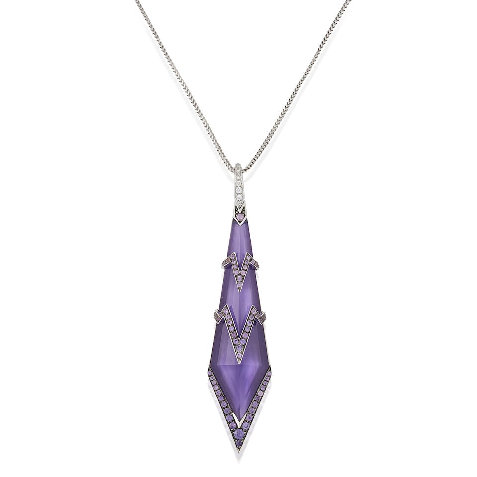 STEPHEN WEBSTER: AN 18K WHITE GOLD GEM-SET 'LADY STARDUST' PENDANT NECKLACE: STEPHEN WEBSTER: AN 18K WHITE GOLD GEM-SET 'LADY STARDUST' PENDANT NECKLACE The large fancy-cut amethyst, backed by mother-of pearl, with lightning bolt motifs set with circular-cut purple sapphires,